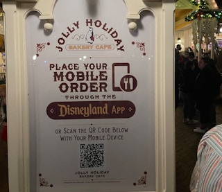 Disneyland restaurant sign with mobile ordering instructions