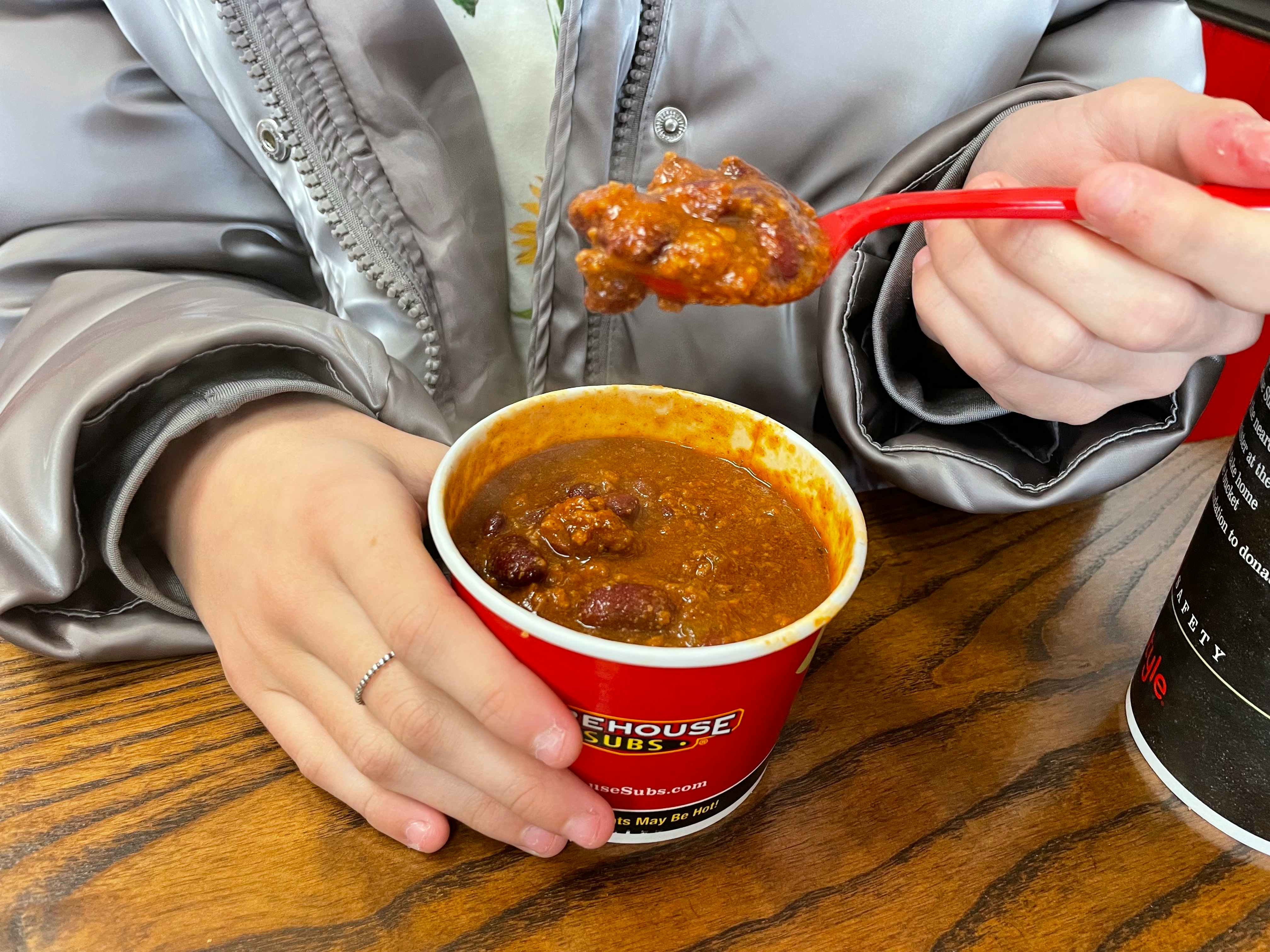 someone spooning firehouse subs chili