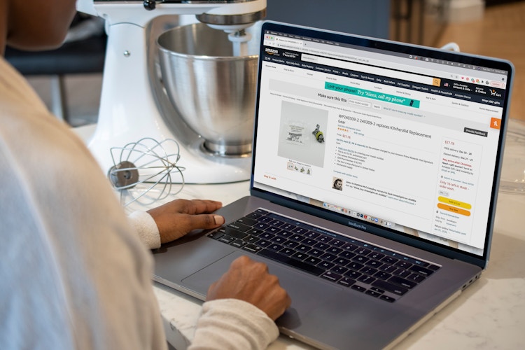 a person looking at kitchenaid parts on laptop on amazon