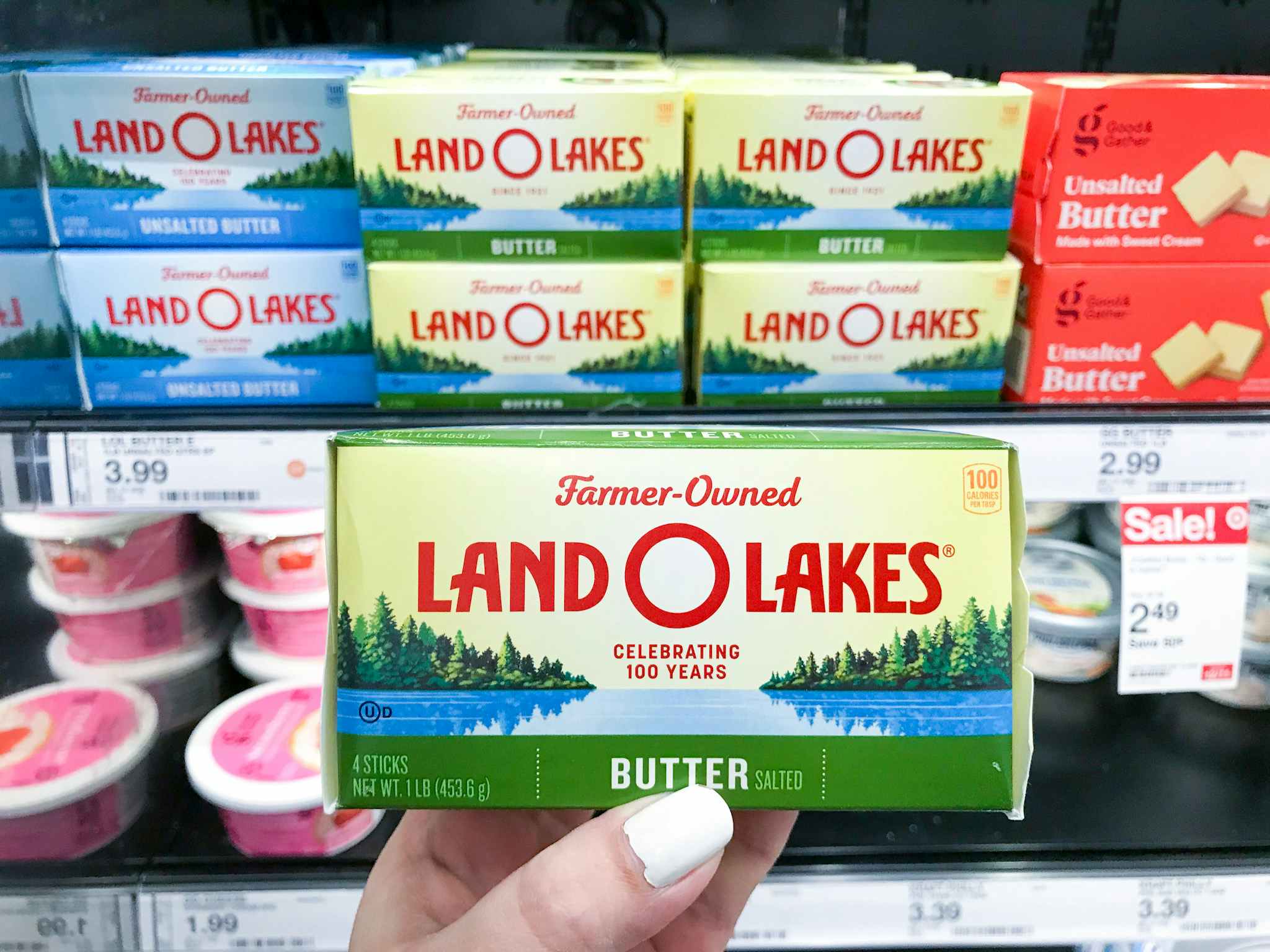 hand holding land o lakes butter at target