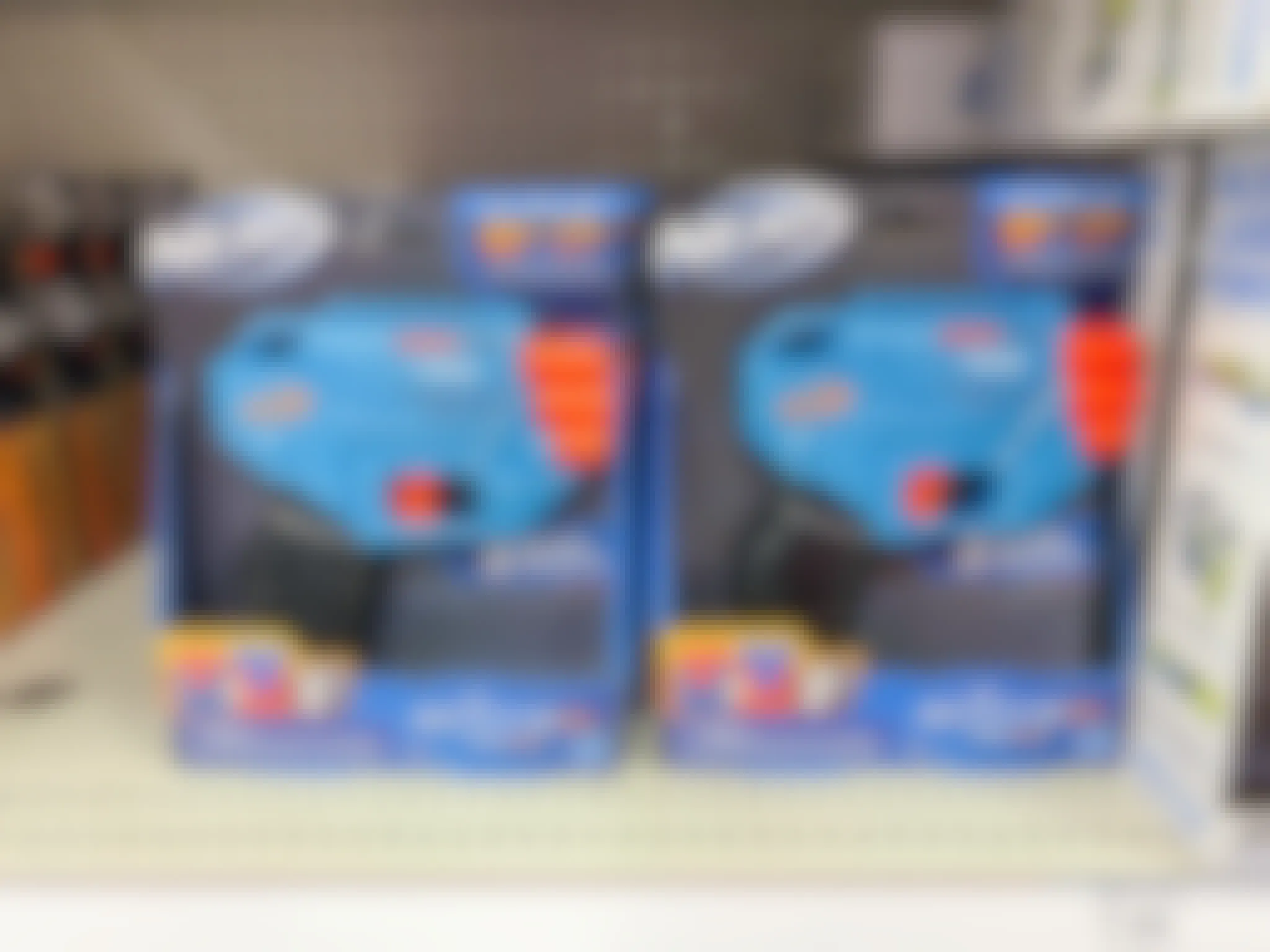 Nerf Elite Trio Blasters stocked on a shelf at Target.