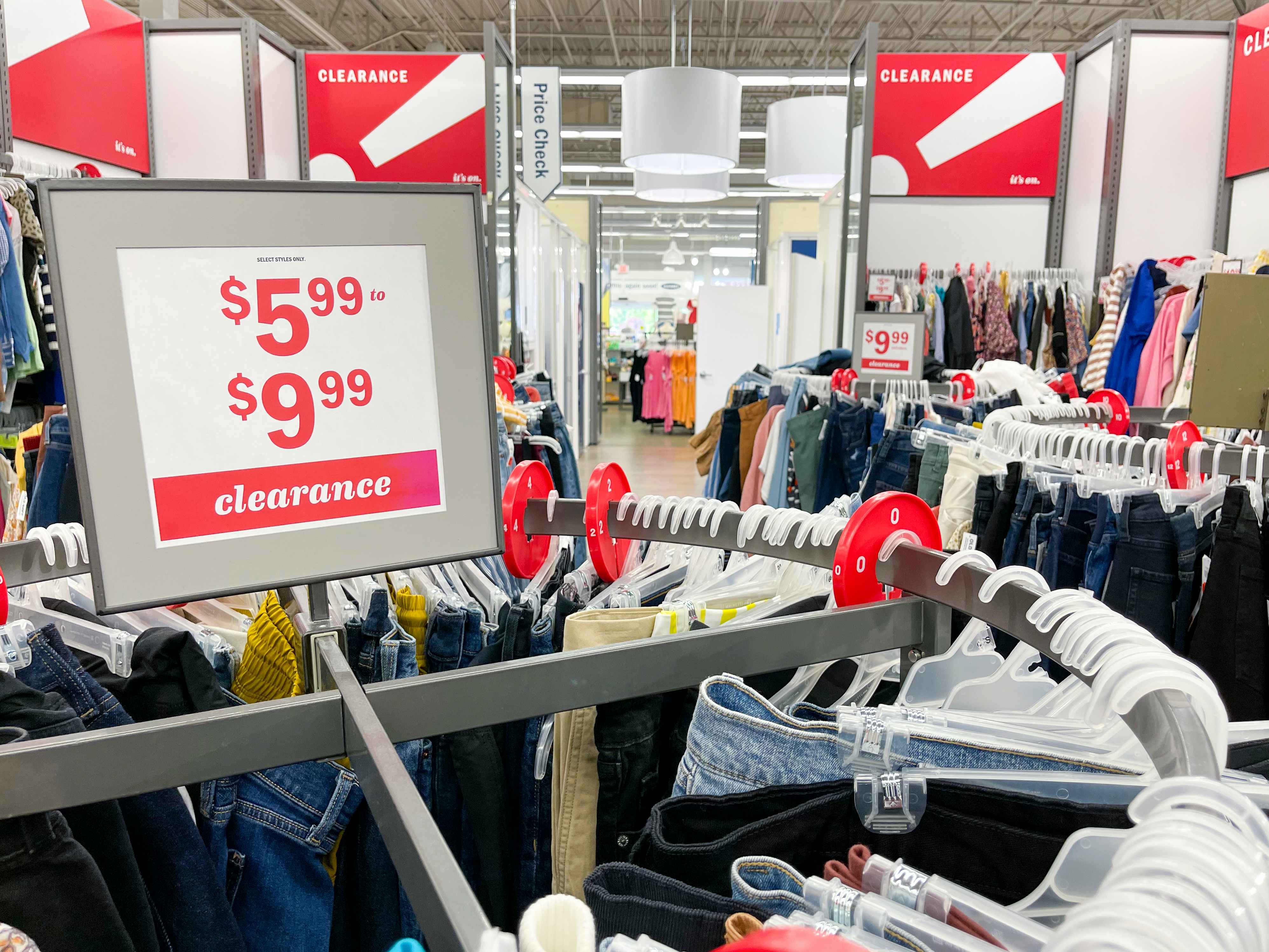 Old Navy clearance racks with sales signs indicating price points of $5.99 to $9.99.