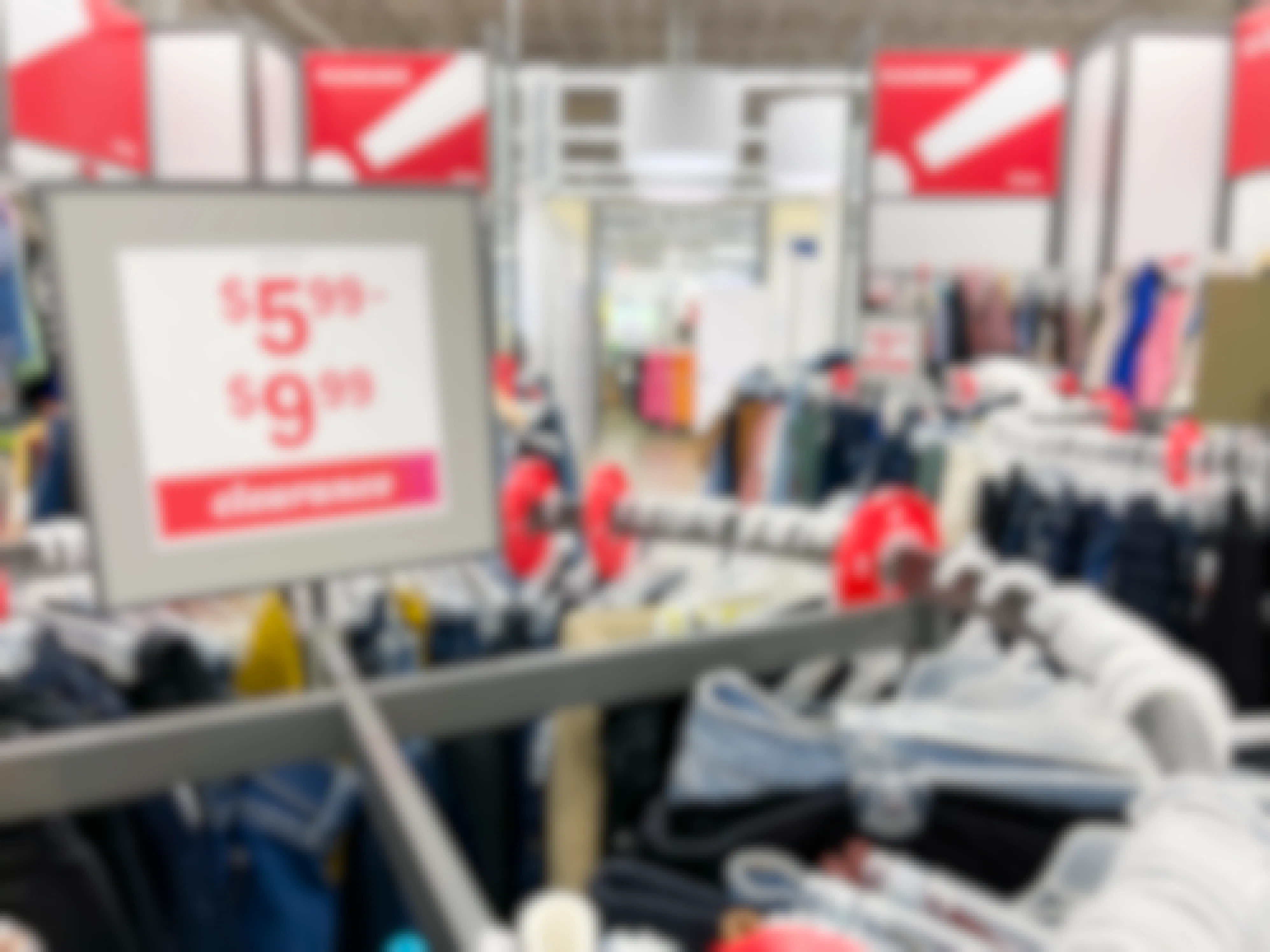 Old Navy clearance racks with sales signs indicating price points of $5.99 to $9.99.