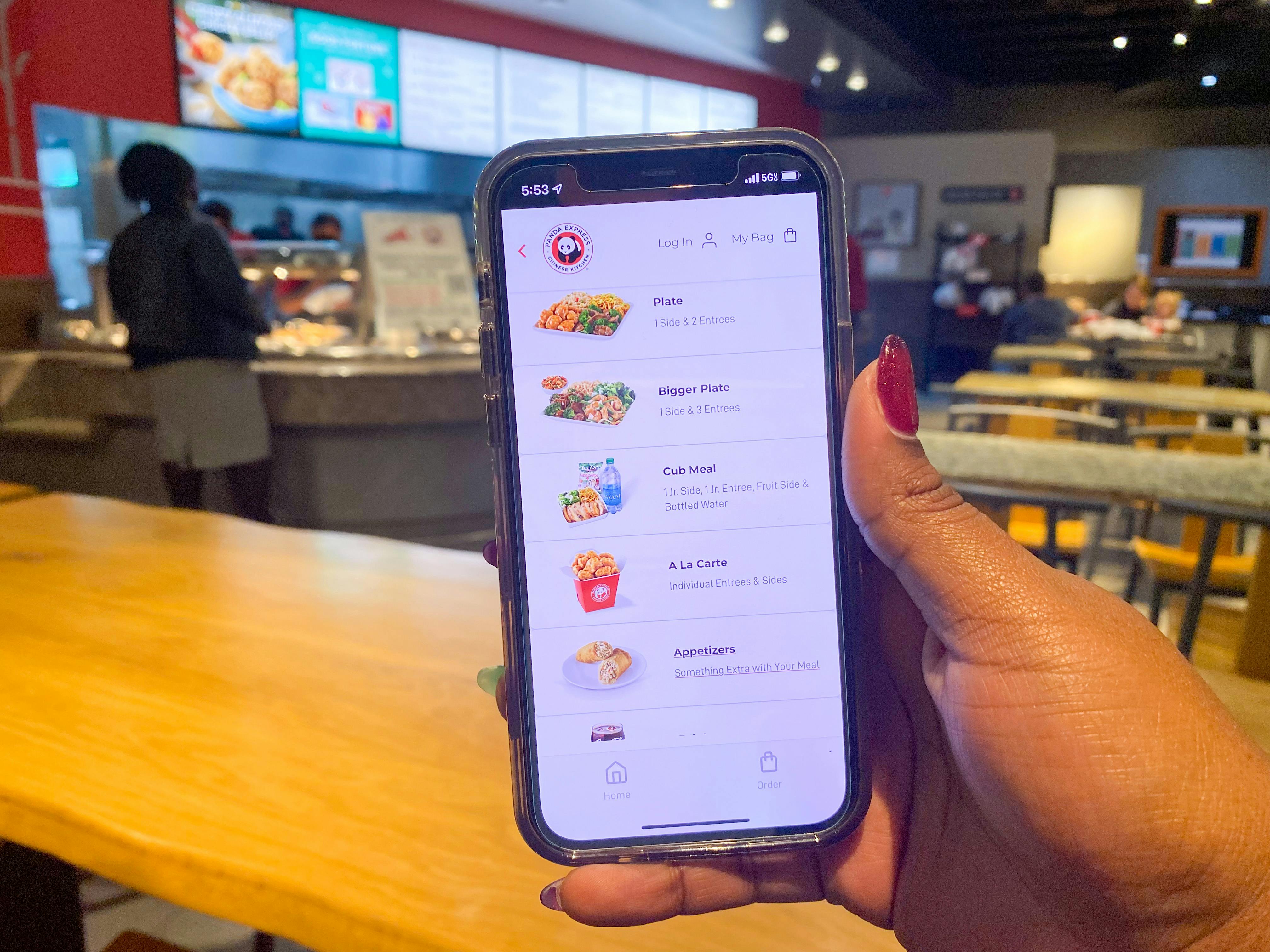 a phone held in hand in Panda Express
