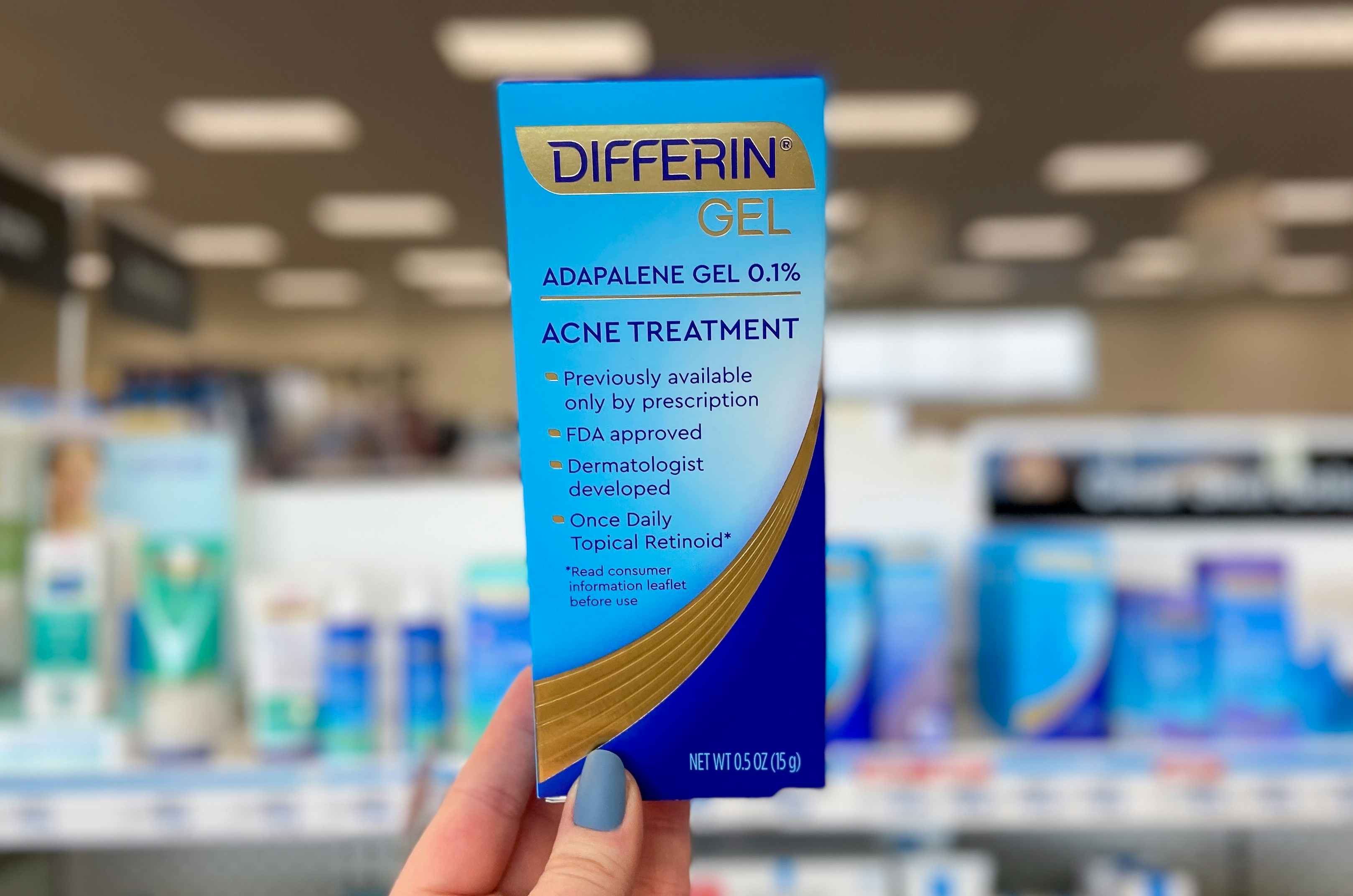 hand holding a box of differin acne gel