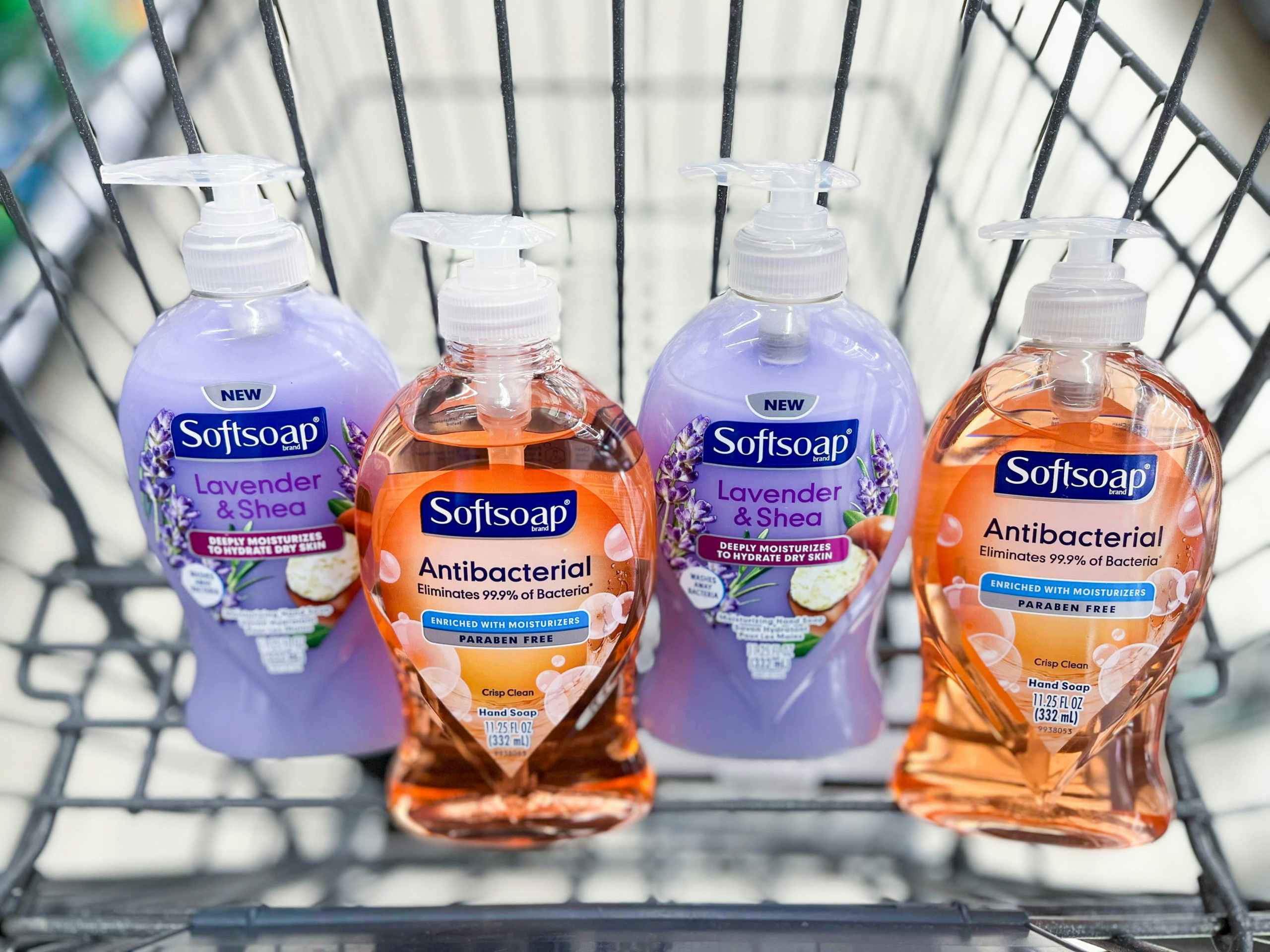 A row of Softsoap antibacterial hand soaps in a cart.