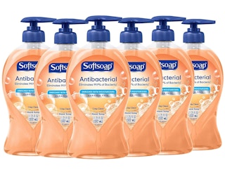A set of six crisp and clean Softsoap hand soaps.