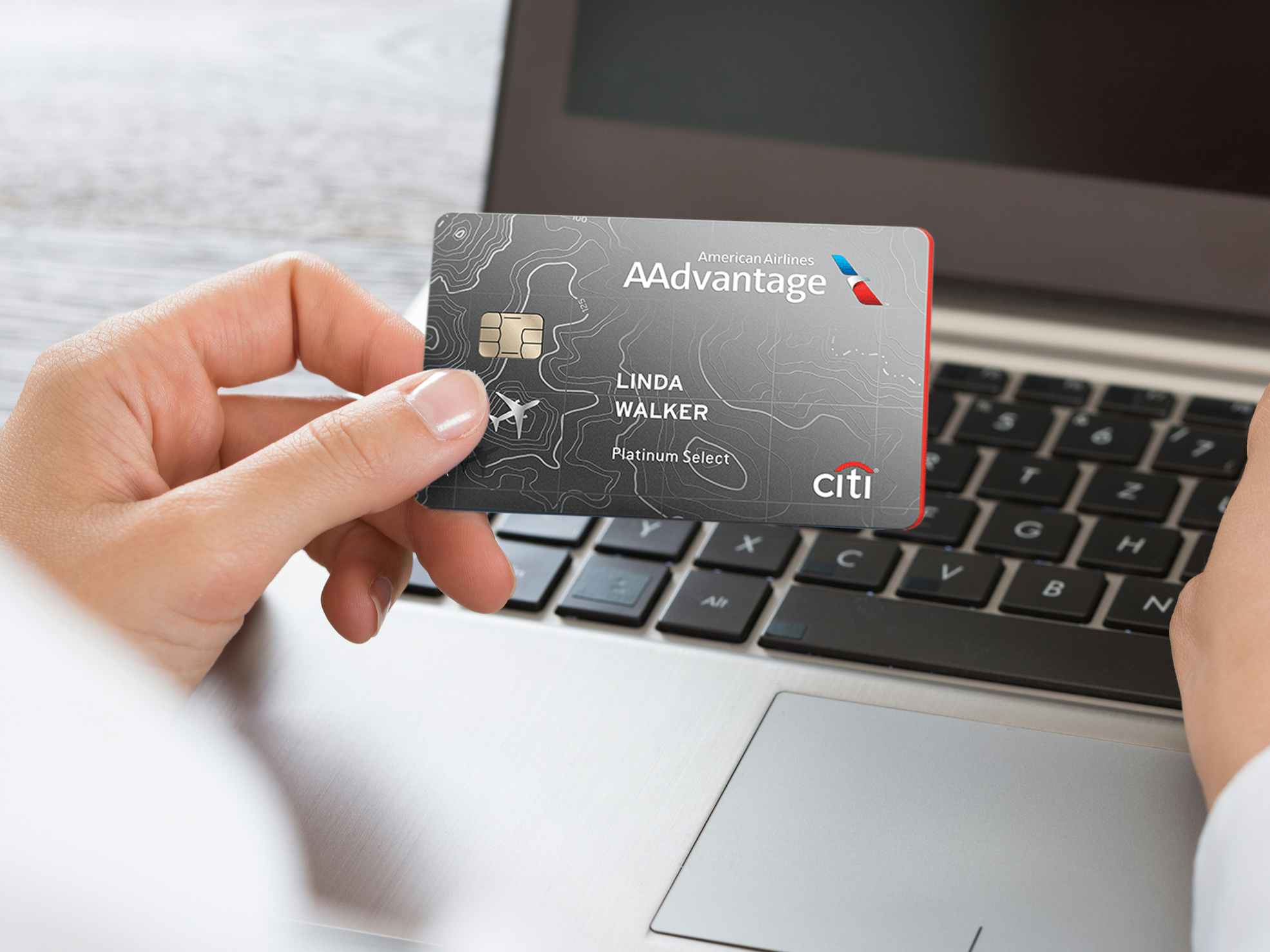 Someone holding an American Airlines Aadvantage credit card