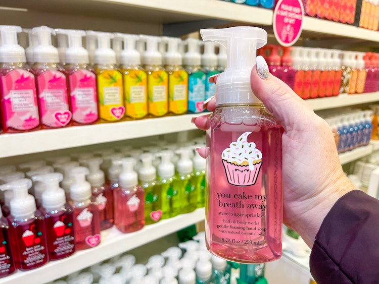 Someone holding a bottle of Bath & Body Works hand soap in store
