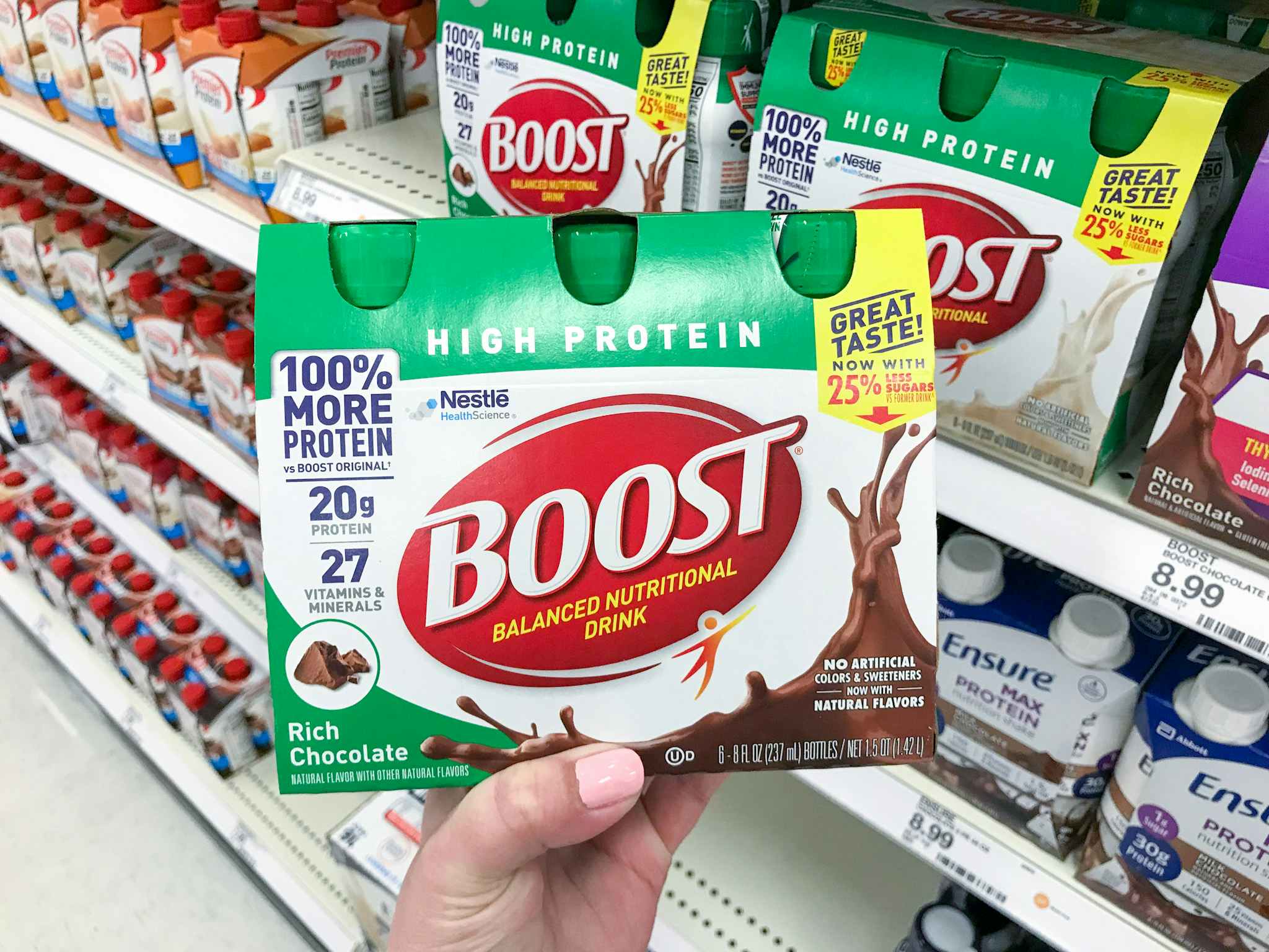 someone holding boost shakes at Target