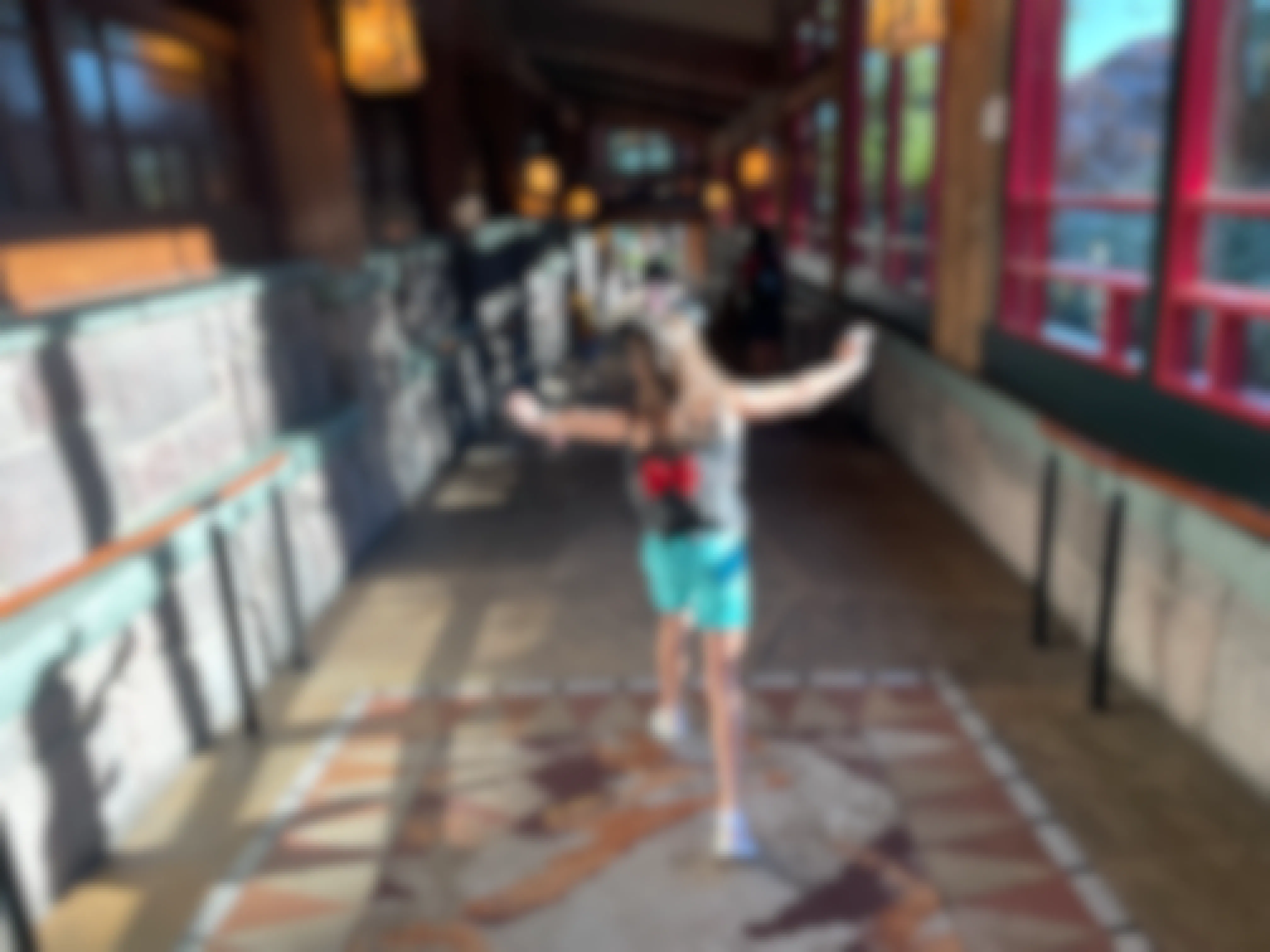 Girl walking in a hallway at a Disney resort hotel