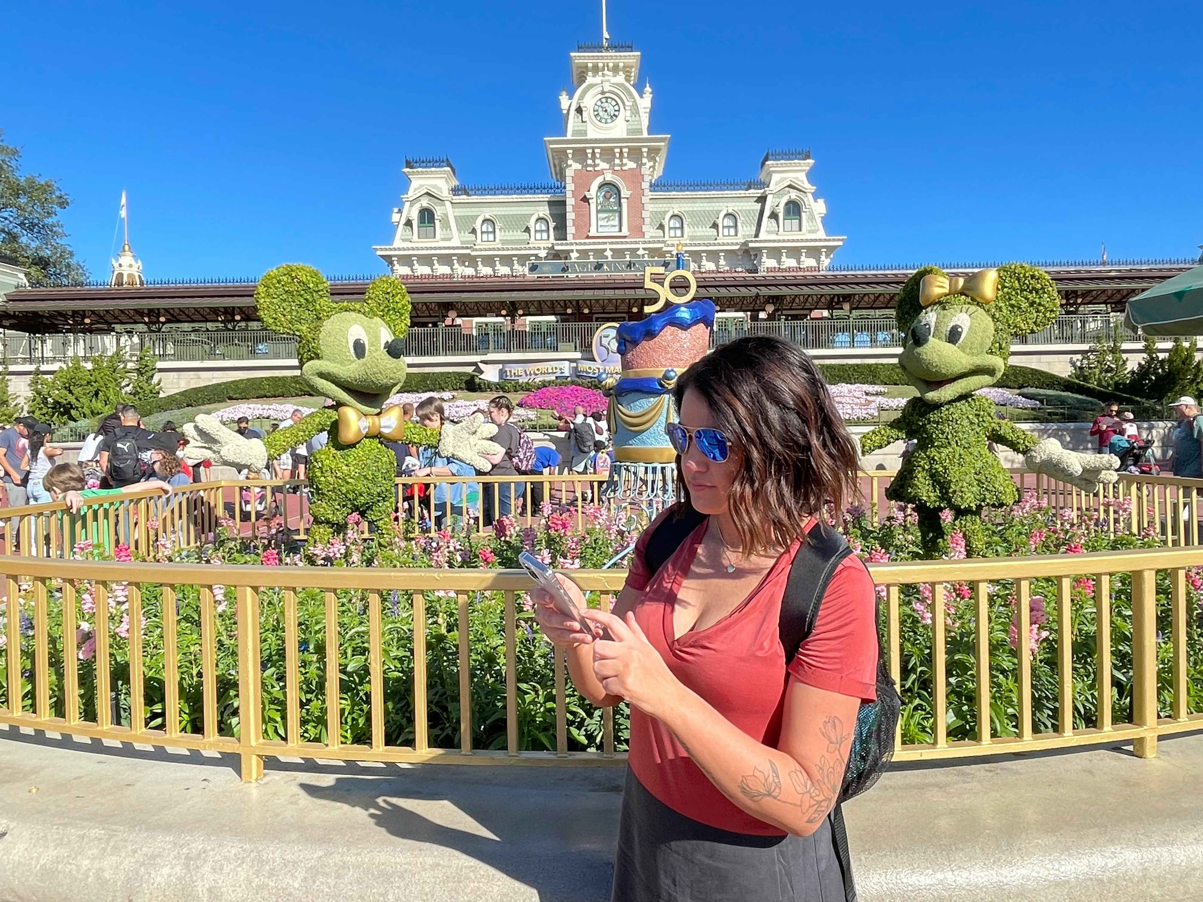Joanie using the Disney World app at park entrance