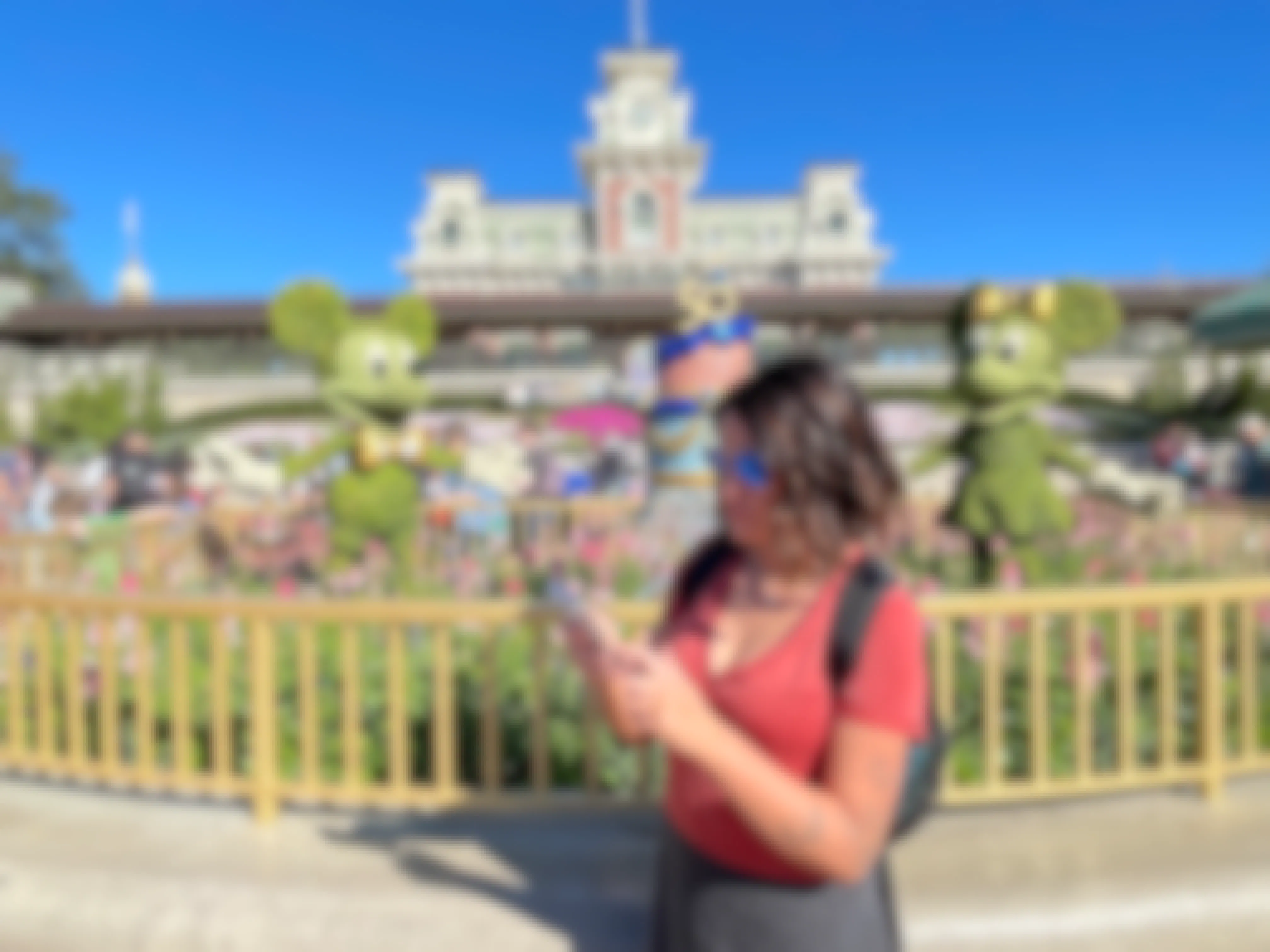 Joanie using the Disney World app at park entrance