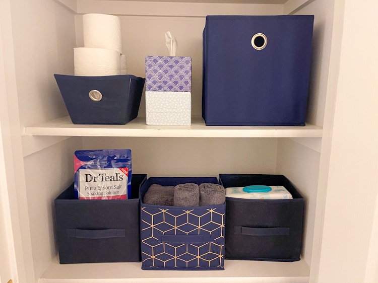 baskets in linen closet