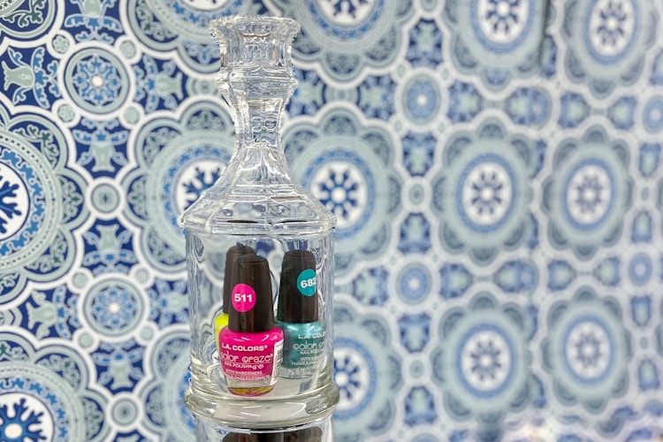 glass bottle with nail polish in it