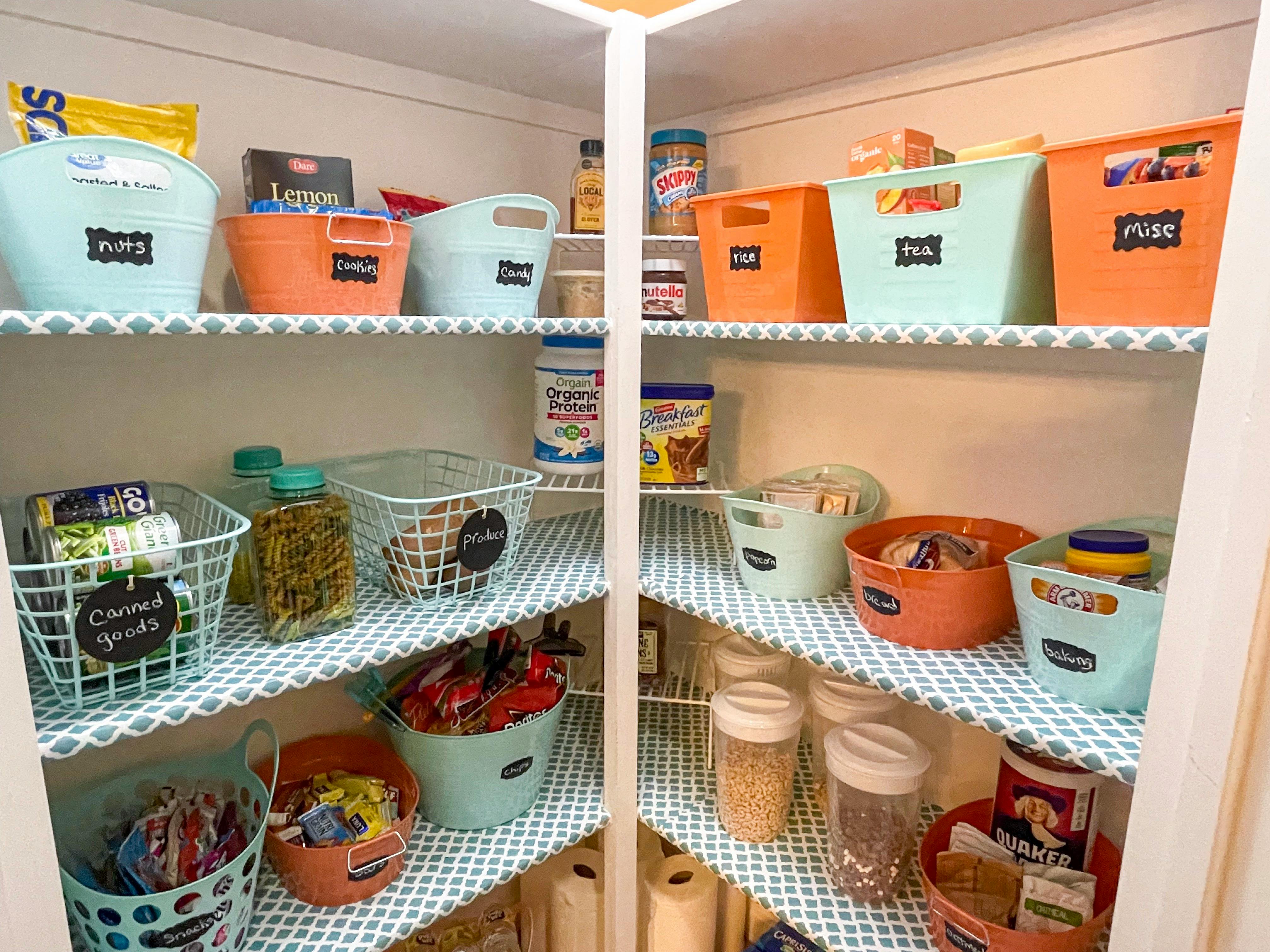 storage baskets labeled in pantry
