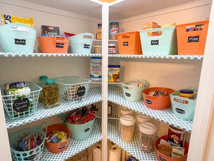 storage baskets labeled in pantry