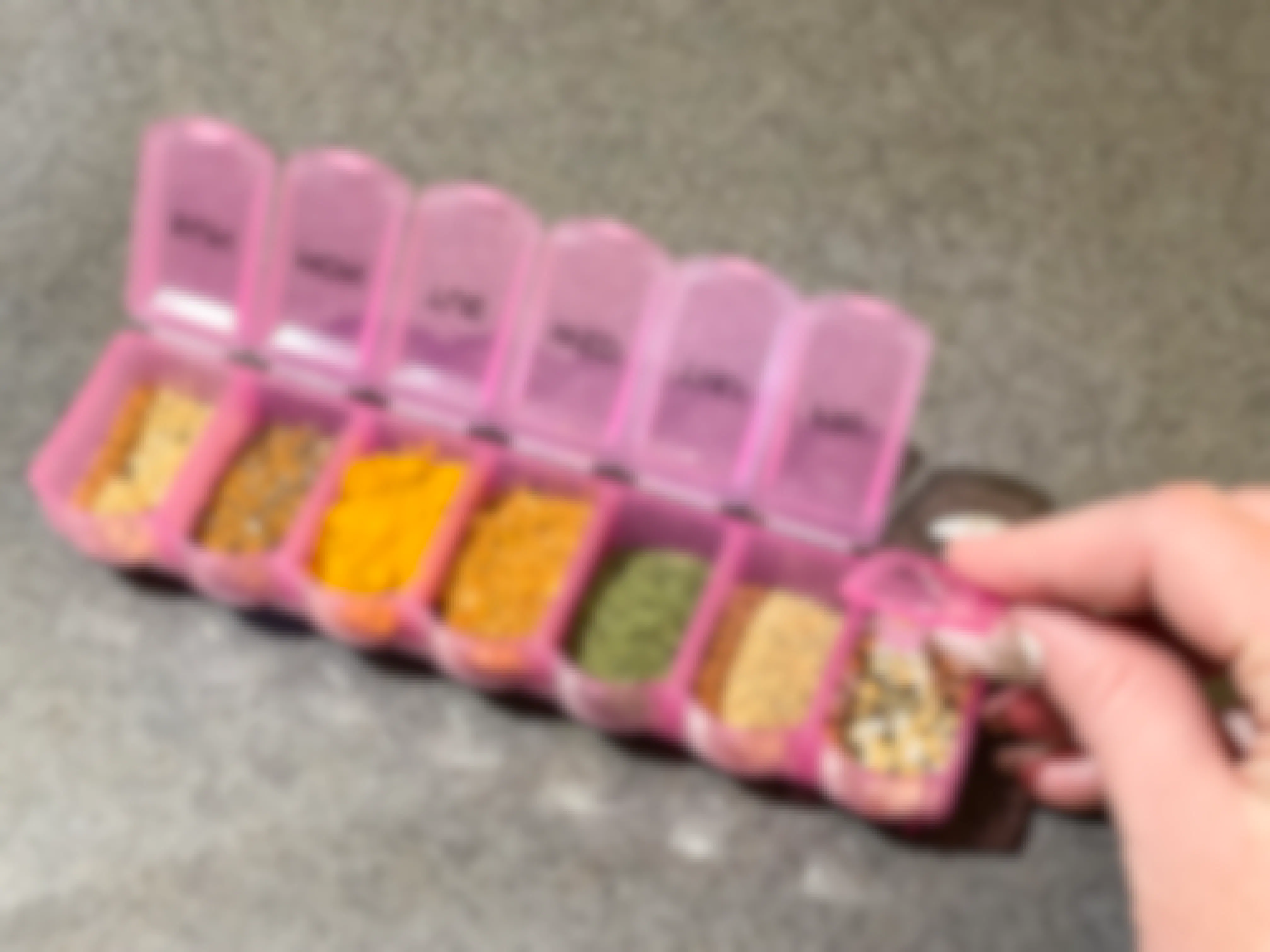 spices put into pill holder 