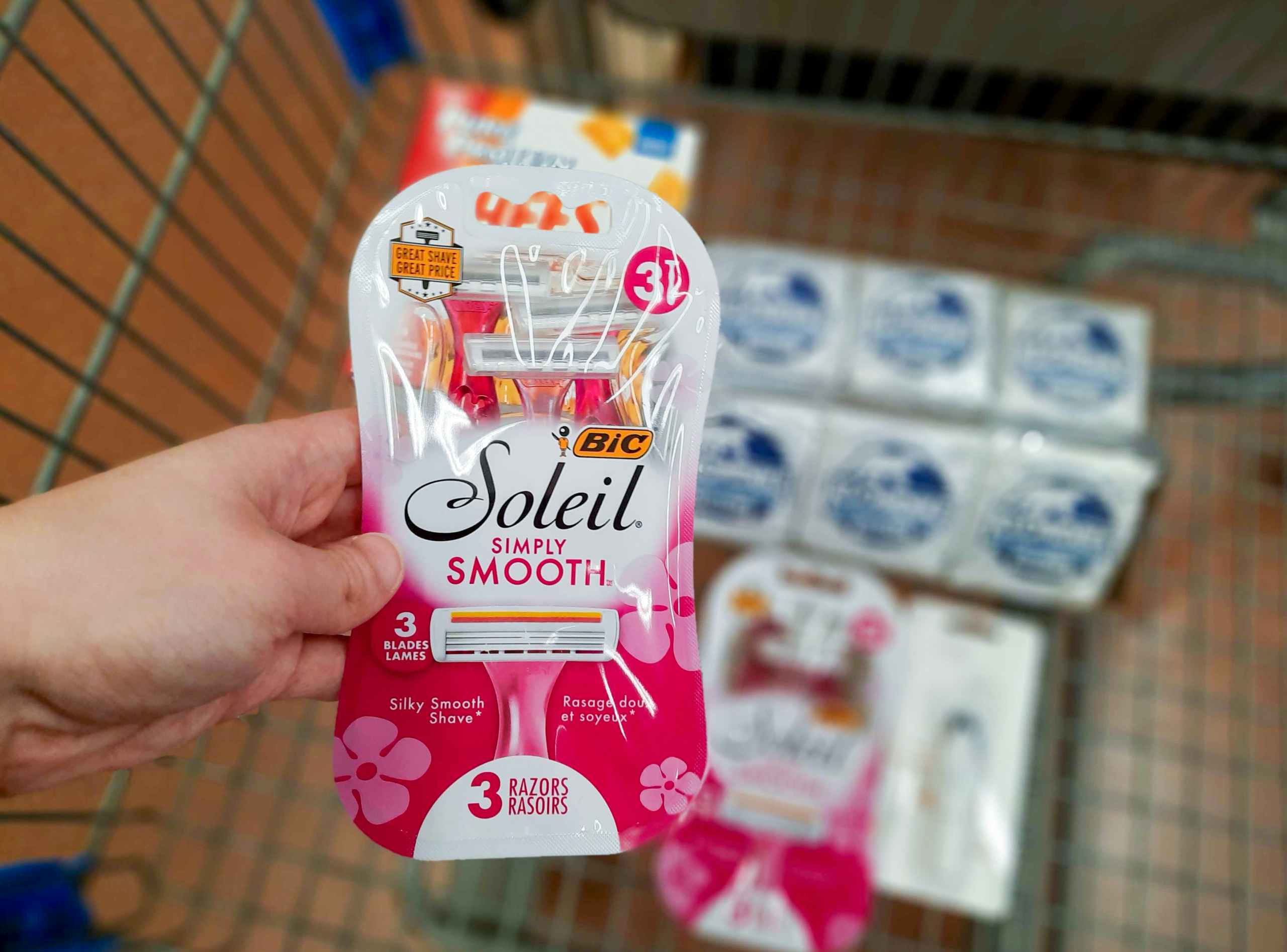 Bic Soleil Simply Smooth Razors held over Walmart shopping cart