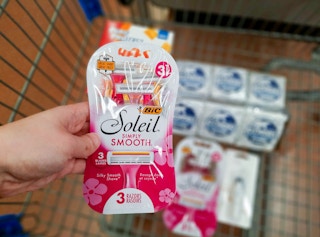 Bic Soleil Simply Smooth Razors held over Walmart shopping cart