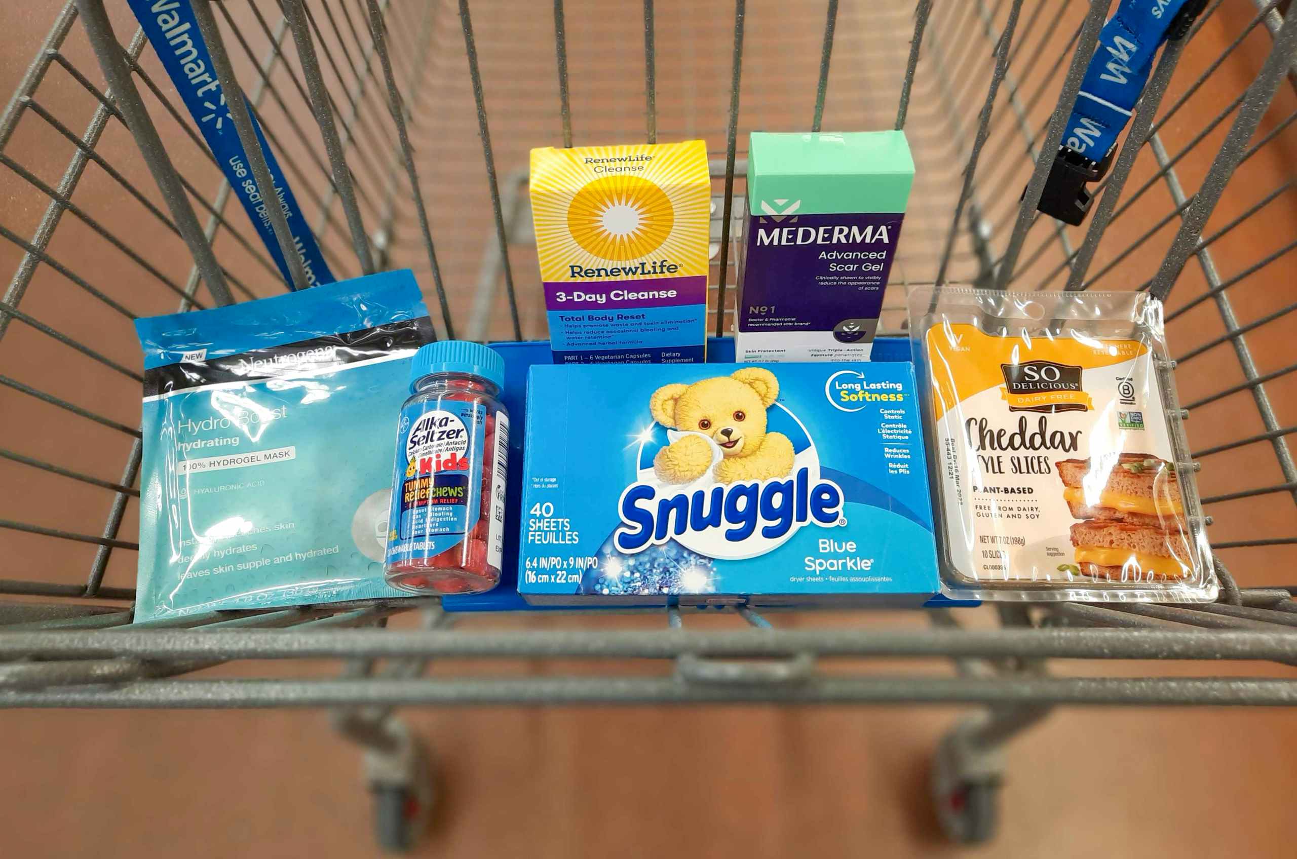 Snuggle, Neutrogena, Alka-Seltzer, Renew Life, Mederma, and So Delicious products in Walmart shopping cart