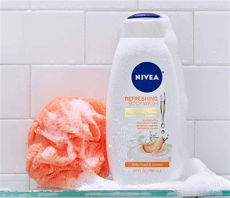 A Nivea body wash on a shower shelf.