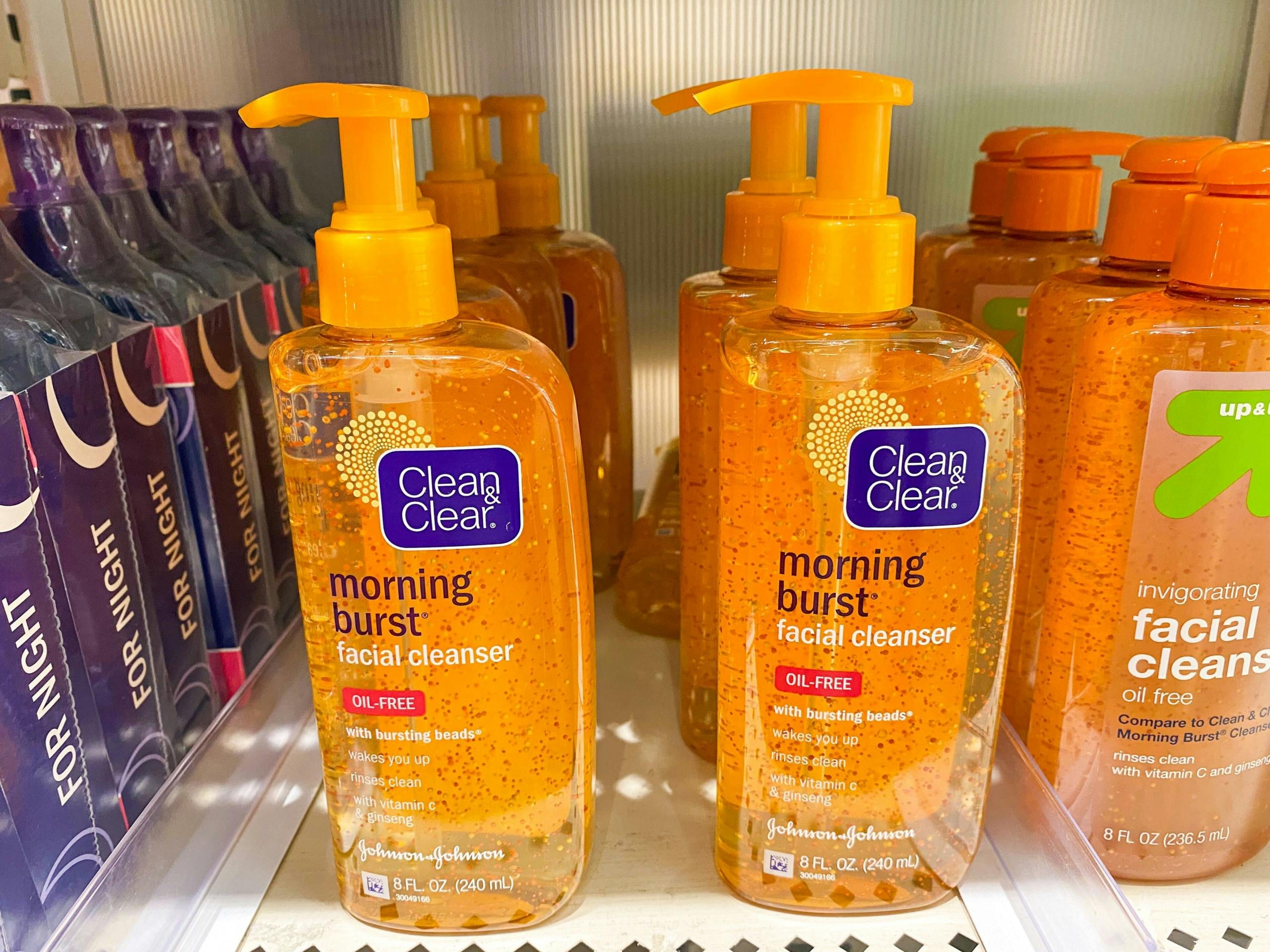 Bottles of Clean and Clear facial cleanser on a store shelf.