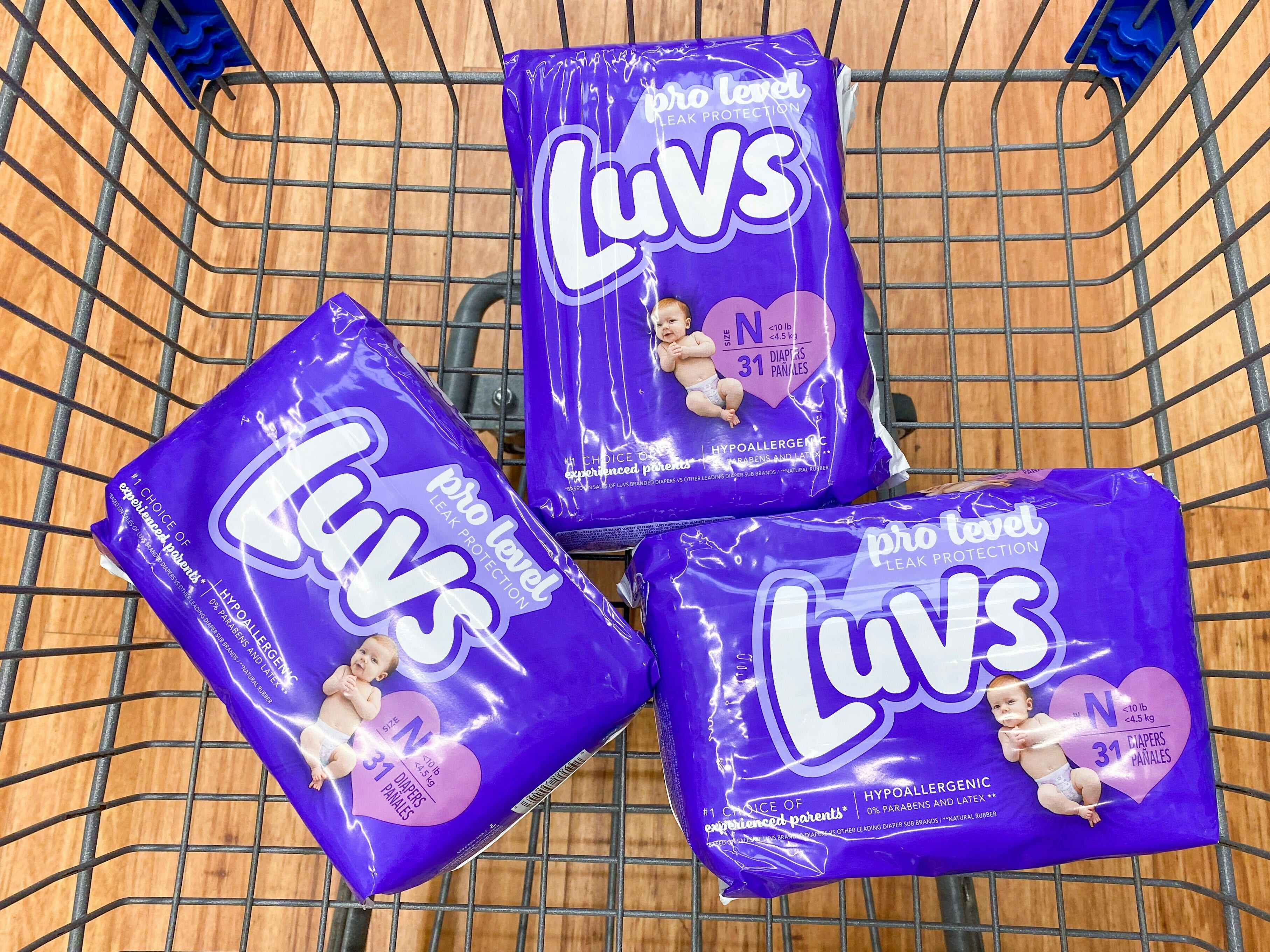 three packs of luvs diapers at walmart in shopping cart