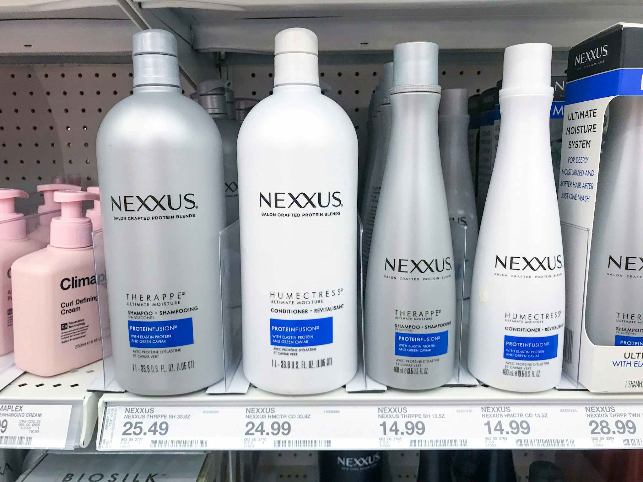 Nexxus Ultimate Moisture hair products on a shelf at Target.
