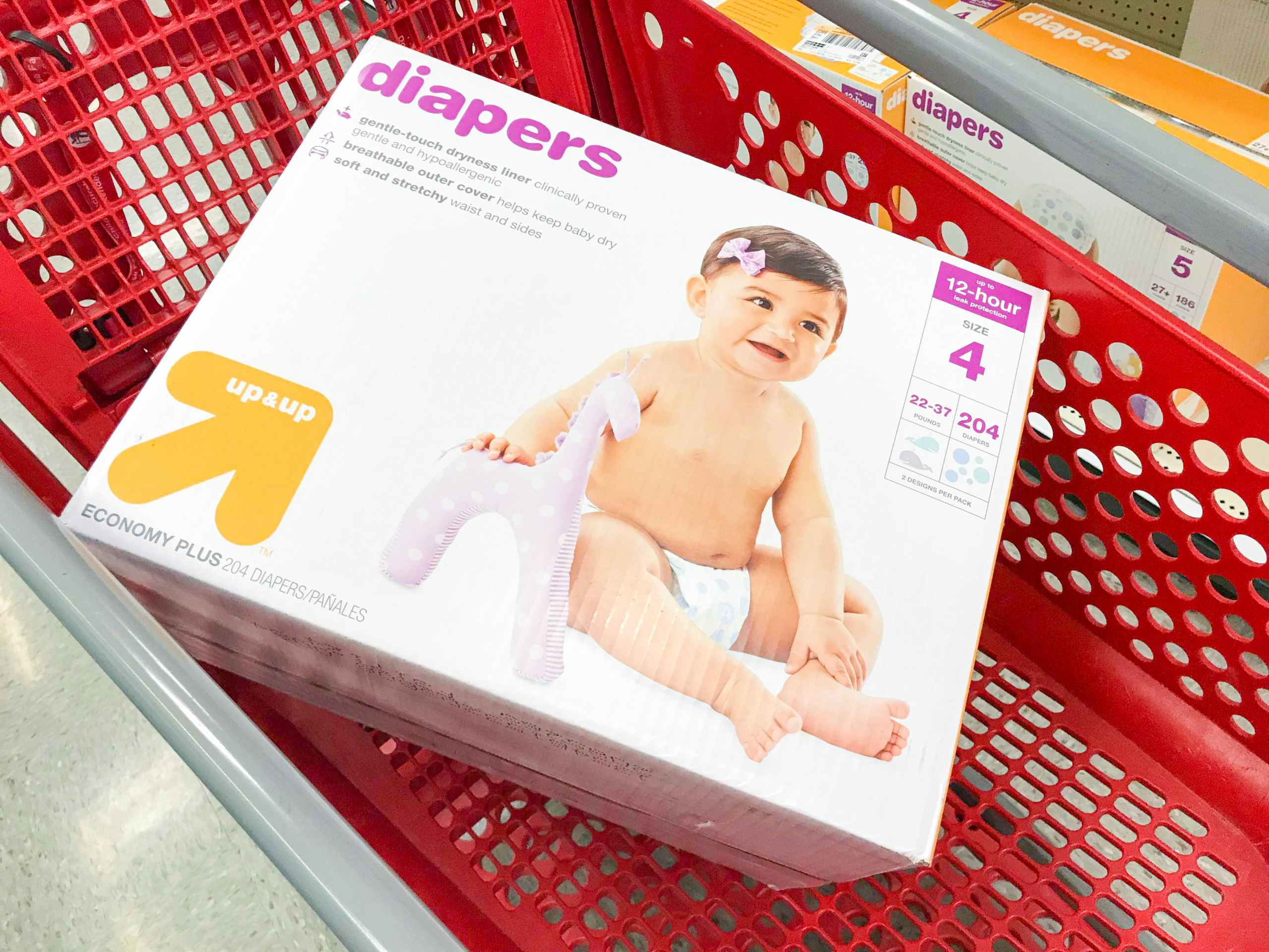 up & up diaper box in Target shopping cart, tilted