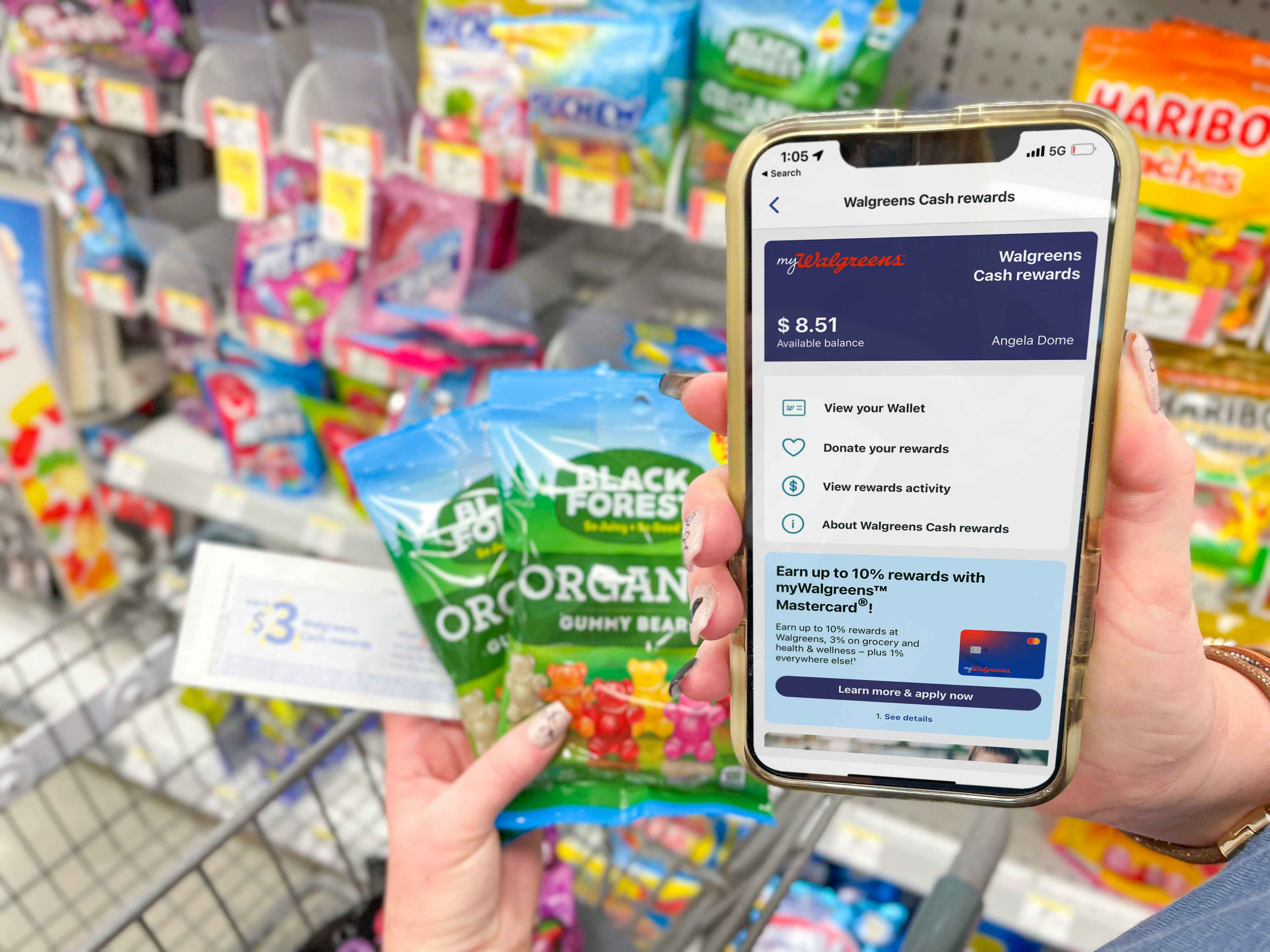 someone holding a phone with walgreens on it, gummybears, and coupon