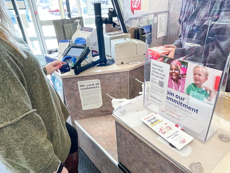 woman checking out at walgreens
