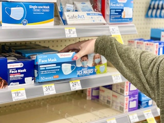 grabbing walgreens face mask box in store