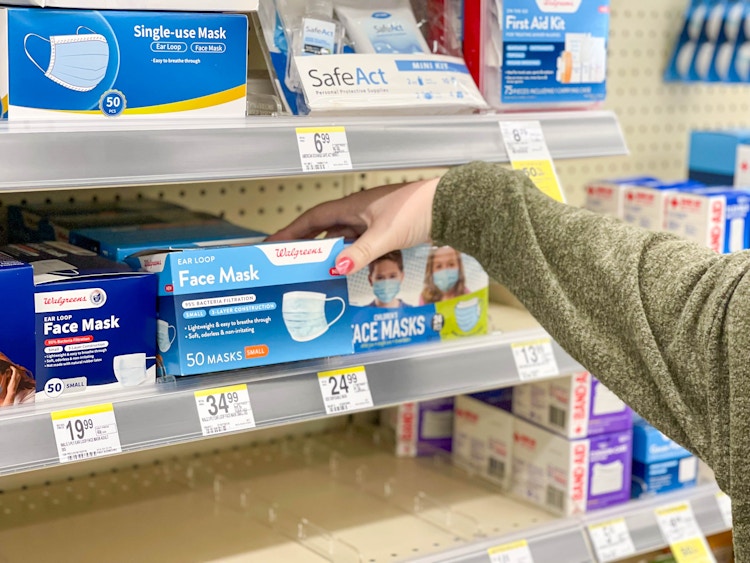 grabbing walgreens face mask box in store