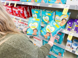 putting pampers diapers in walgreens cart