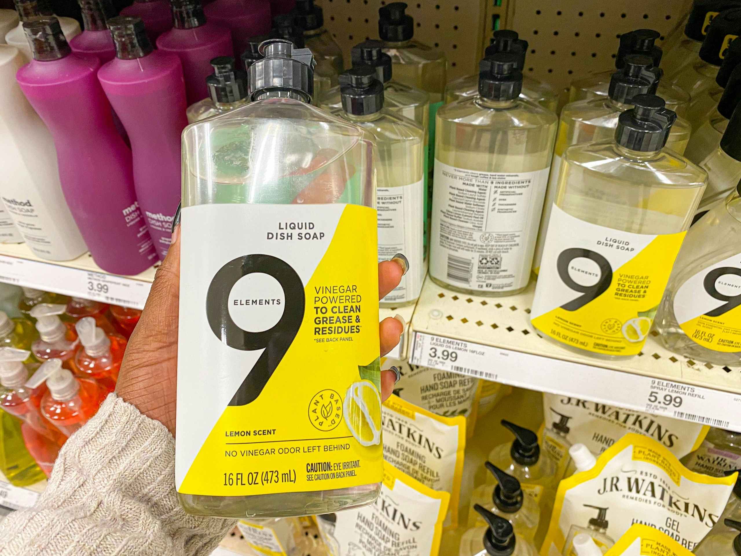 hand holding 9 elements dish soap at target