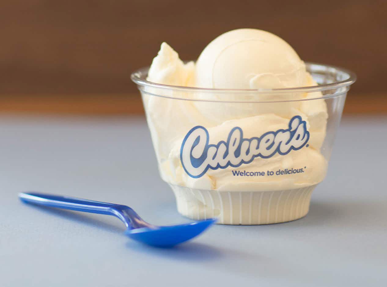 Culvers scoop of frozen custard in a cup with a spoon 