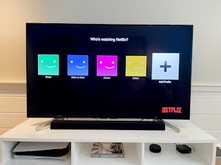 Tv showing the Netflix profiles screen asking who's watching Netflix