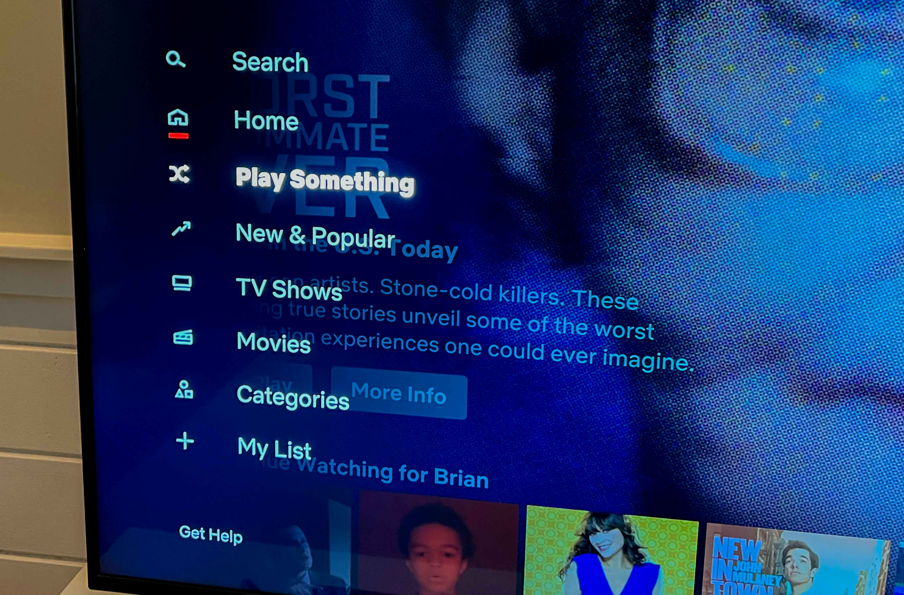 tv screen showing the netflix app open and the option to "play something" selected from the left menu
