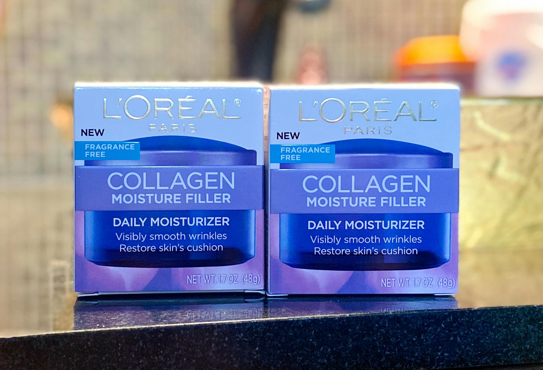 Boxes of L'Oreal Skincare Collagen Cream on a table.