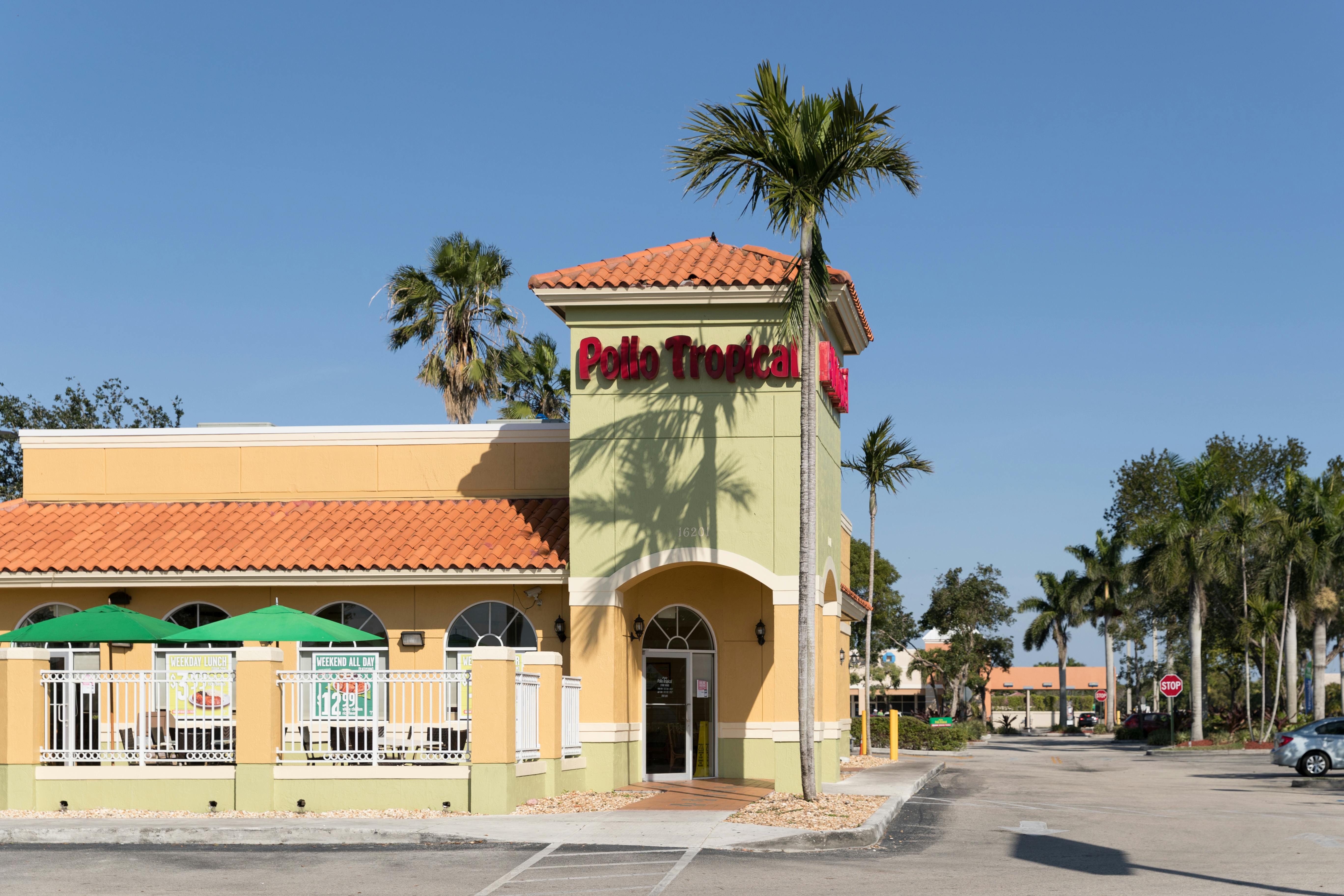 The exterior of a Pollo Tropical restaurant.