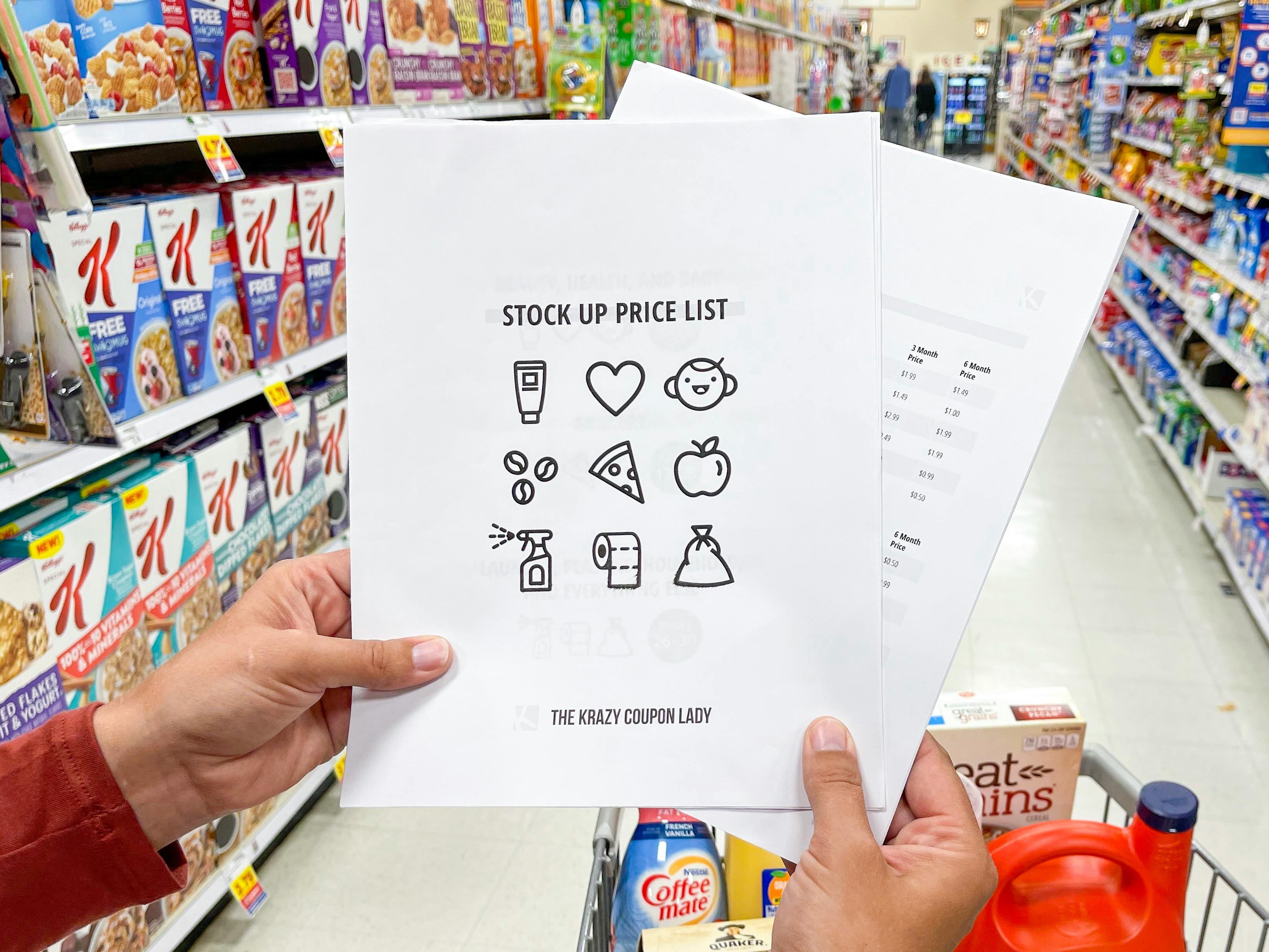 a person holding the stock up price list
