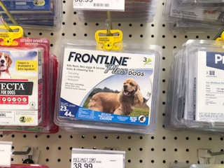 Frontline Plus medicine hanging on a store hook.