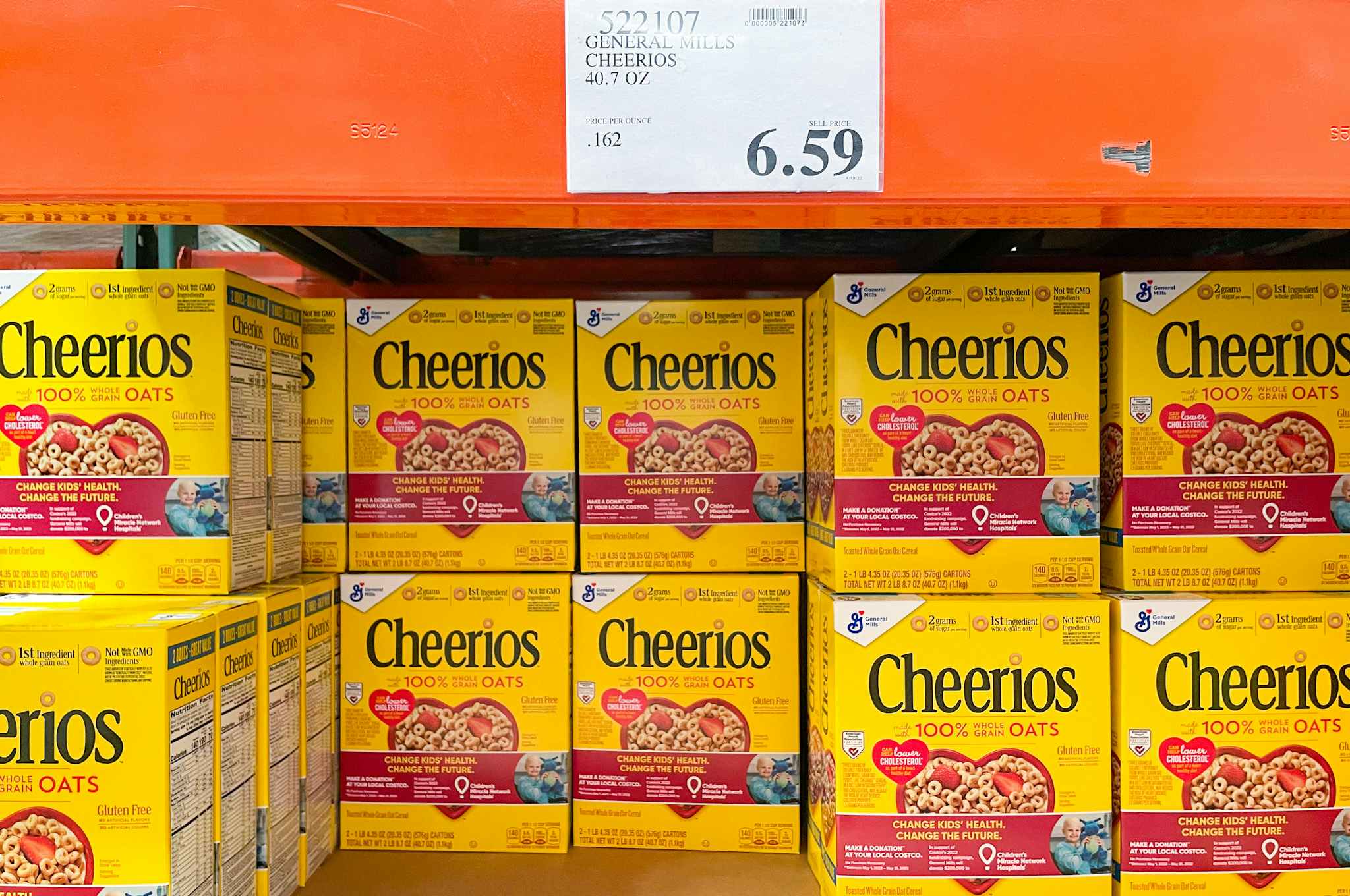 Bulk boxes of Cheerios stacked in a grocery store