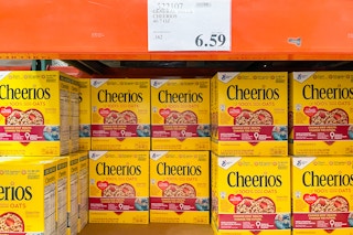 Bulk boxes of Cheerios stacked in a grocery store