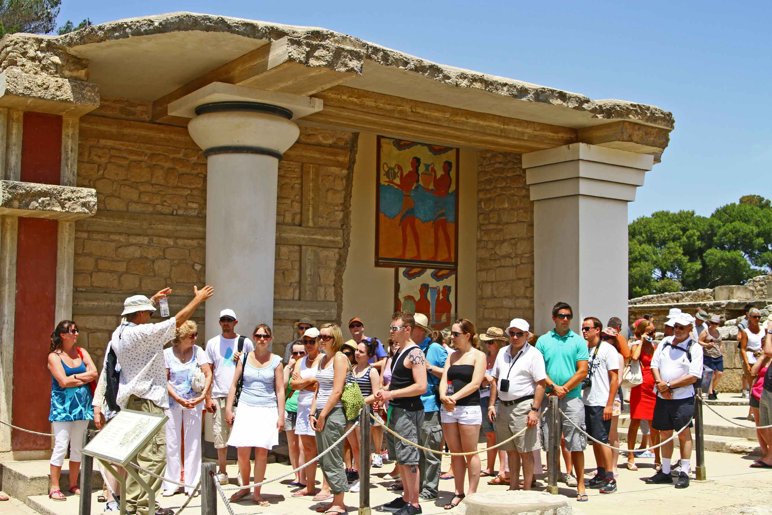 Tour group gathered at a Greek temple