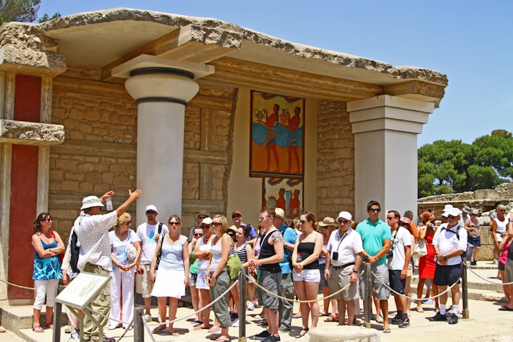 Tour group gathered at a Greek temple