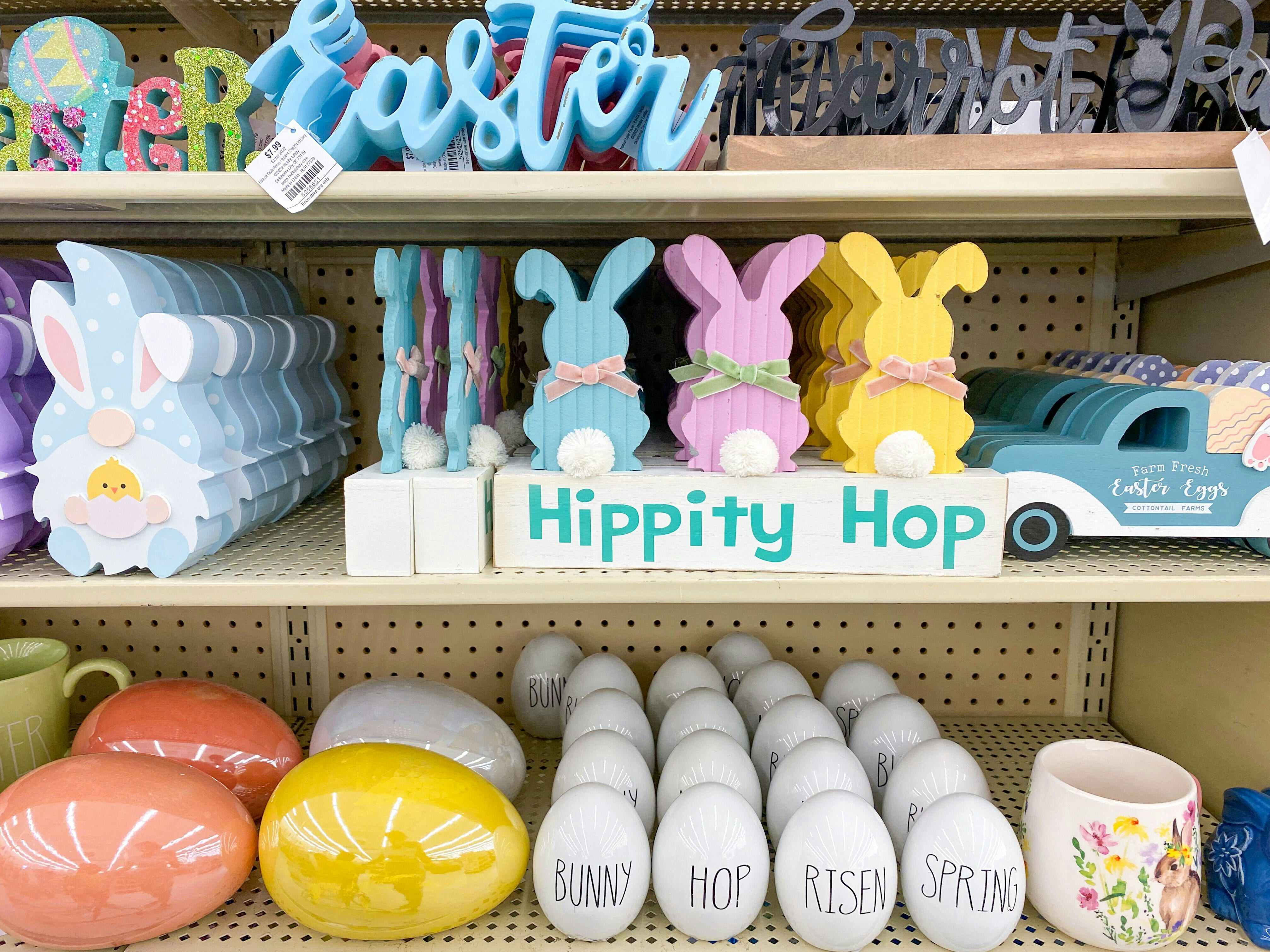 Easter decor tabletop signs and figurines on the shelves at Hobby Lobby