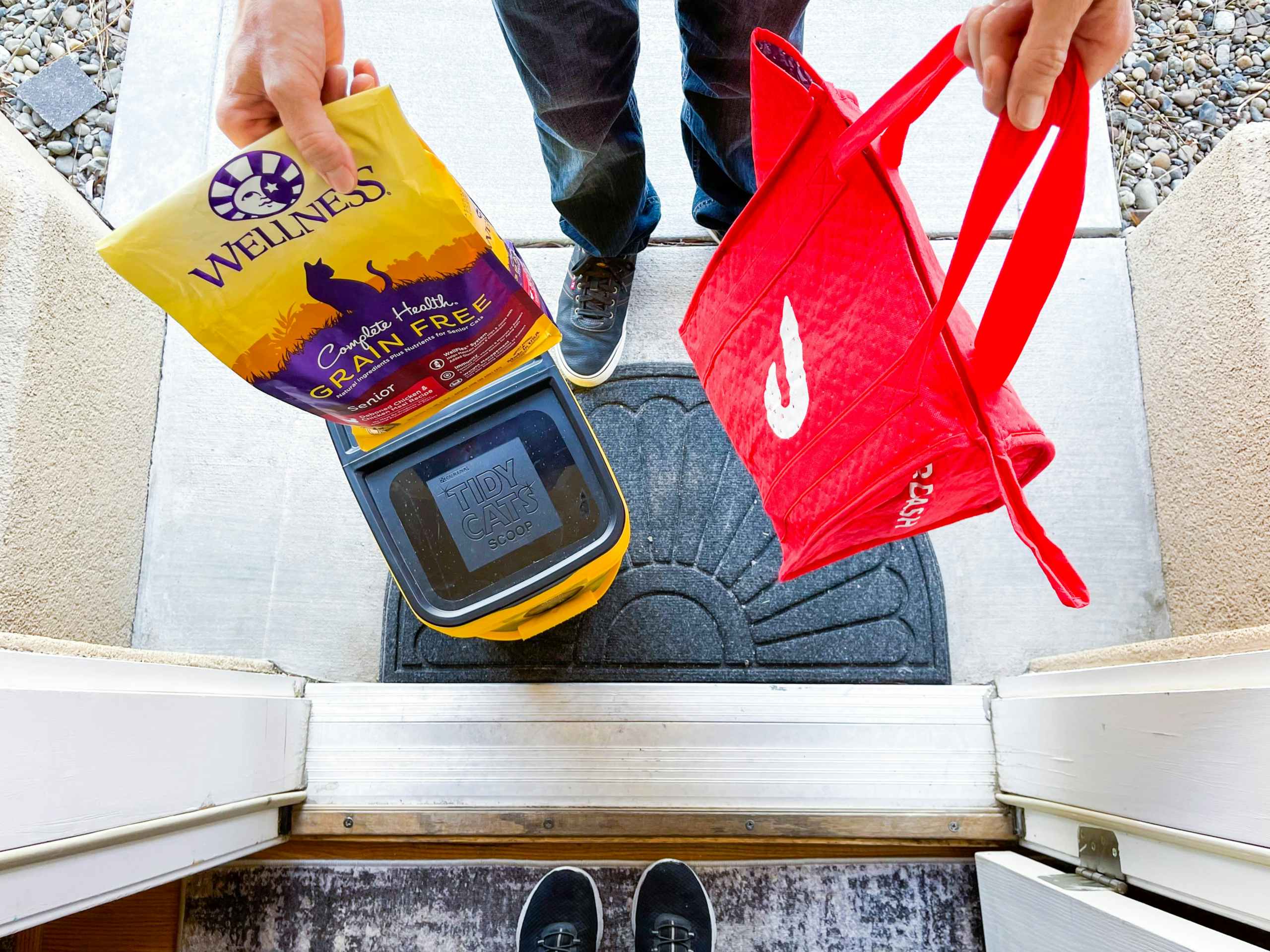 a person delivering pet food and cat litter through doordash