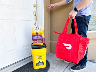 a person delivering pet food and cat litter through doordash